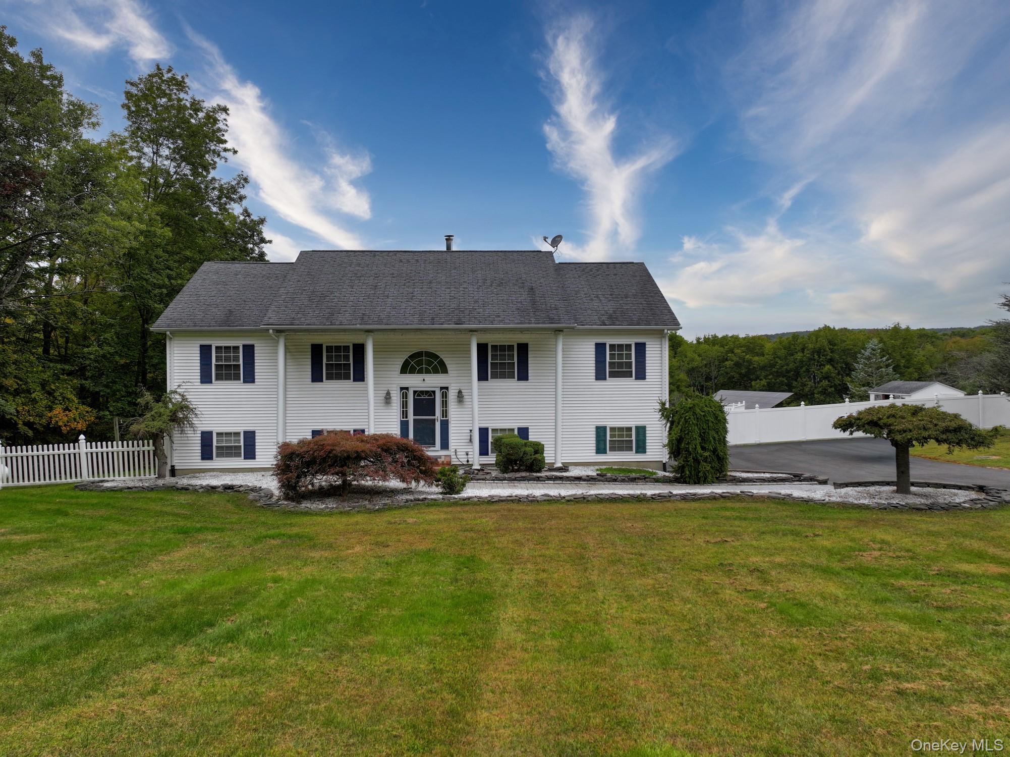 Enjoy 2, 132 square feet of comfortable living space on 2.6 beautiful acres in a serene country settingâ€”just 10 minutes from shopping, restaurants, and more.Located at 125 White Bridge Road in the town of Mount Hope, NY, this raised ranch offers far more than just a place to live. Itâ€™s a retreat, a gathering space, and a canvas for everyday joy.Step inside through a spacious foyer and ascend to a sunlit living room with gleaming wood floorsâ€”perfect for curling up with a novel or hosting guests in a cozy, open setting. The living room flows seamlessly into the dining area and kitchen, creating a welcoming space for entertaining and day-to-day living.The kitchen is freshly painted and features a chef-level gas range, stainless steel appliances, and generous counter space for culinary creativity. beautiful resilient manufactured floors connect the kitchen and dining room, and sliding doors lead to a deck where you can take in the views and sunsets.The main level includes a hallway full bath freshly painted and tiled and a large primary bedroom with ensuite bath and exceptional his-and-hers closets, plus two additional spacious bedrooms-All freshly painted with new carpeting. Downstairs, the lower level offers a versatile layout: a large family room, an office, a bedroom, and a full bathâ€”ideal for game day gatherings or private guest accommodations. Sliding doors open to a walk-out patio, extending the living space outdoors.And hereâ€™s a standout feature: a fully owned solar array in the backyard. No roof holes, no leasingâ€”just clean energy and savings. How does an electric bill of as low as $28/month sound? To top it off, enjoy summer days in your own well-maintained above-ground pool, complete with a sunbathing deck and privacy fencing. A large shed provides convenient storage for pool and yard equipment.Finally, oil heating and hot water are supplied by 2 above ground oil tanks located in a spacious 2 car garage.