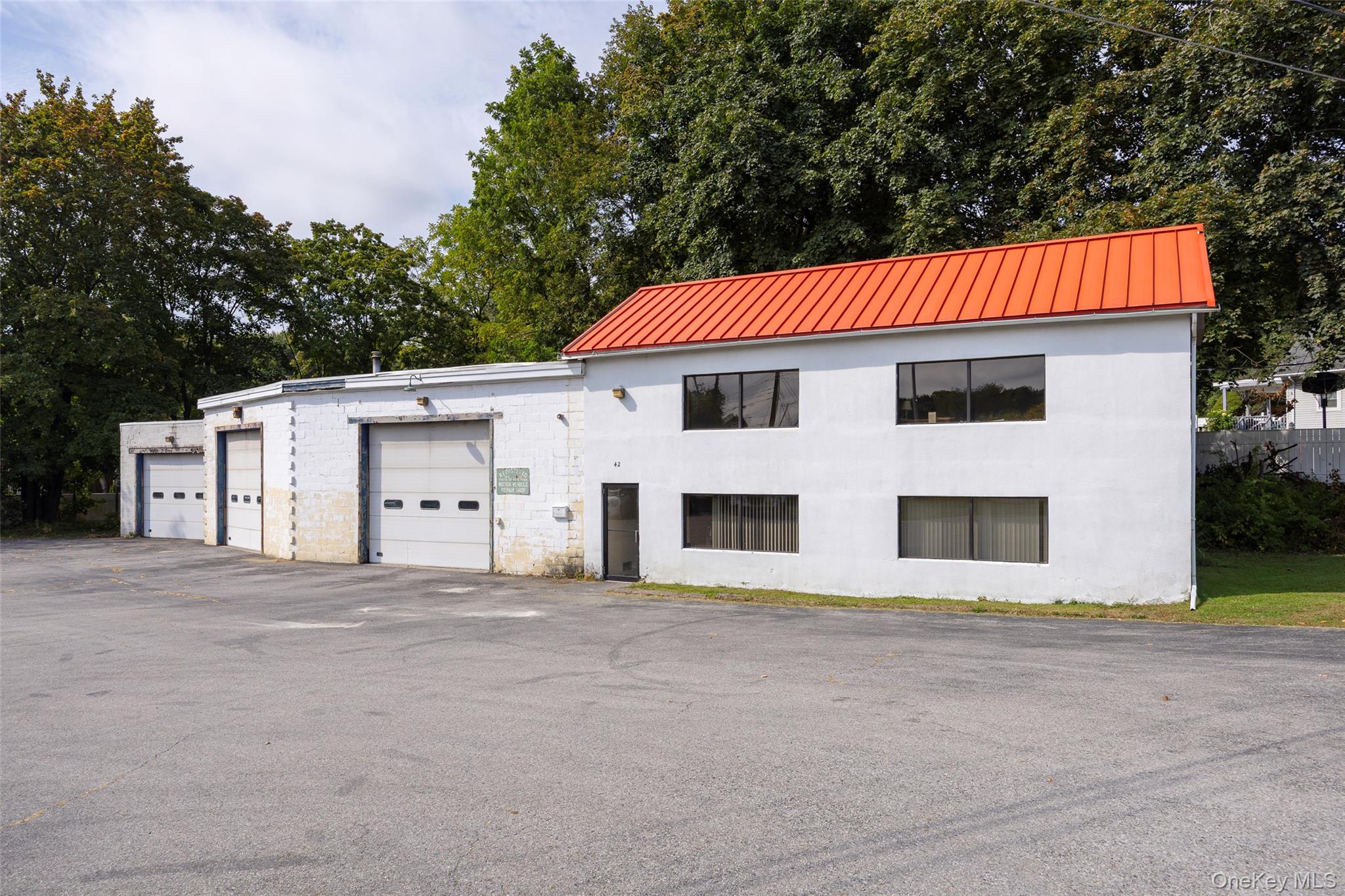 Centrally located warehouse with three large bays, workshop & two story office space. 21&rsquo; ceiling with three overhead doors and five lifts for a turnkey operation. Office space includes first floor waiting room, two offices & restroom plus second floor office and restroom. Block structure with municipal water/sewer & natural gas. Arlington Town Center zoning conducive to a multitude of uses. Easy access to Route 55, Route 44 & Taconic State Parkway. An exceptional opportunity for use in the current configuration or redevelopment.