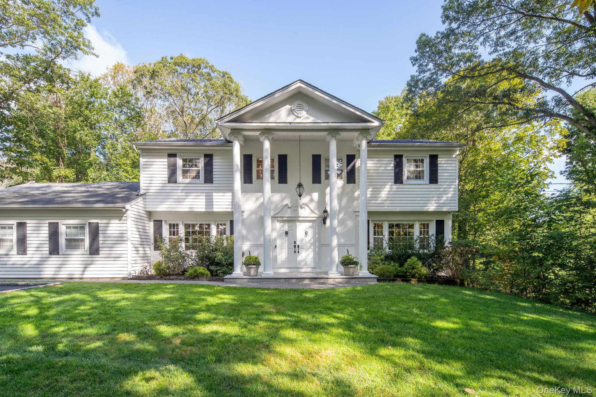 Impeccably updated and truly move-in ready, this elegant 4-bedroom, 3-bath Center Hall Colonial sits on a full acre in the heart of Dix Hills. Thoughtfully designed for both everyday living and entertaining, the home features a stunning Chefâ€™s kitchen with quartz countertops, a walk-in pantry, and an expansive center island with seating for five and abundant storage.The adjacent dining area is perfect for hosting, complete with a wet bar and dual full-size wine refrigerators. Enjoy open-concept living spaces with gleaming hardwood floors throughout, and relax in the great room with a cozy wood-burning fireplace and picturesque views of the patio and backyard.A well-appointed mudroom offers convenience for busy households, while the new patioâ€”complete with Sonos soundâ€”creates a seamless indoor/outdoor living experienceâ€”ideal for dining al fresco or simply unwinding in your private, park-like setting.Additional highlights include: 8 zone irrigation system, 2 car garage with EV charging station, new condensers - 2022 & 2024, Hot Tub, Filtered tap water on main floor, smart home enabled cameras.Located in the Half Hollow Hills School District and nestled in Dix Hills, this home blends modern luxury with classic charm.