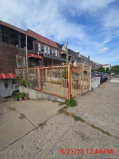 brick attached 3 family with 3 two brr unis. Walking distance o all amenities