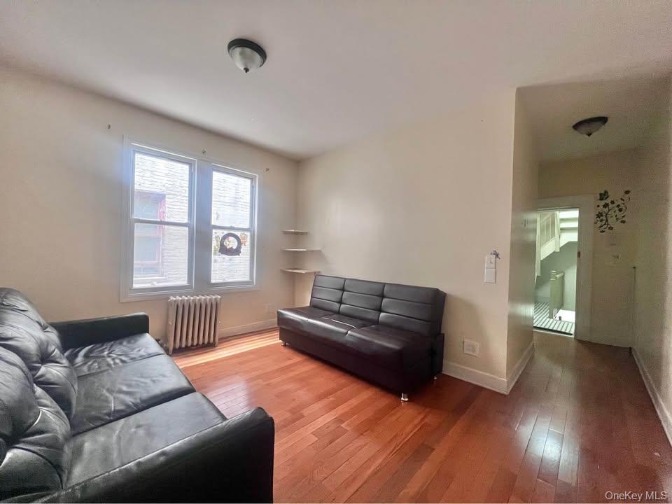 Cozy 1 bedroom with 9 foot ceilings. Second floor walkup. Small pet may be considered. Income, credit and background check required. Location close to Elmhurst Hospital, Shops, Subway!