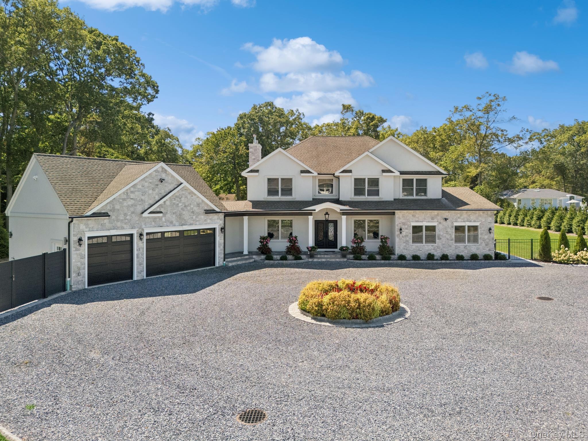 Luxurious newly built custom Colonial on 1.3 acres offers the scale and presence of a true East Northport estate. A long and private drive takes you into a Center Island courtyard and leads you into a three + garage and a welcoming Impressive front approach, with potential unfinished loft over garage for more living space.Enter in a double wrought Iron custom doors, soaring ceilings and oversized windows fill the home with light. Chef&rsquo;s Kitchen with a 48 six-burner range, state of the art appliances, Quartz island and custom White cabinetry flows into the family room with natural wood-burning fireplace.The main level features a bedroom suite and full bath for guests or multi-generational living, a large bonus room and access to a full unfinished basement with outside entrance. Central vacuum system provides modern convenience throughout.Upstairs, bedrooms are generously proportioned with walk-in closets, while bathrooms offer spa-quality finishes with floor- to-ceiling designer 3D tile. Second floor full laundry room adds everyday ease.Step out into a backyard designed for resort living, with a natural gas heated saltwater pool, spillover spa, and porcelain decking that stays cool underfoot. Natural gas BBQ, Surround sound speakers, Expansive flat lawns, manicured landscaping surrounded by giant evergreens each with there own water source right down to the drive way entrance for a possible water feature and electric for entry gates. Thoughtful planning on this unparalleled residence right down to an amazing vegetable garden complete the estate.