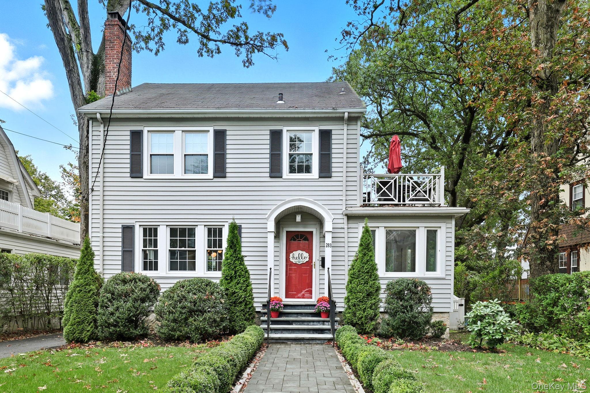 Welcome to this picture-perfect Colonial that blends timeless character with fresh, stylish updates. The inviting exterior features crisp gray siding with black shutters and a charming arched entryway. Lush landscaping and a brand-new stone walkway add to the homeâ€™s welcoming curb appeal. Inside, sunlight fills the 1st floor, where a flowing layout connects the living, dining & kitchen spaces. The living room is bright and airy, framed by large windows and French doors that open to the entry foyer. The open-concept dining area and kitchen create a modern gathering space w/custom white cabinetry, stone countertops & stainless steel appliances offering both style and function. A sunroom provides a serene spot for a home office or den, while the mudroom, with powder room and access to the rear deck, completes the main level. Upstairs, the 2nd floor offers 3 sun-filled bedrooms, including a spacious primary, a full bath w/white tile and modern fixtures, and access to a rooftop deck/balcony - perfect for morning coffee or evening relaxation. Highlights include classic crown molding, built-ins, freshly painted interior, and warm hardwood floors throughout the home. Step outside, and the fenced backyard is an inviting space with a new spacious Trex deck and a beautifully finished stone patio, ideal for dining al fresco or unwinding outdoors. The property offers level lawns, thoughtful landscaping, and a convenient location within walking distance to New Rochelle High School and only 1.5 miles to Metro North station. Thoughtfully updated yet full of classic details, this home offers an effortless balance of comfort and character.
