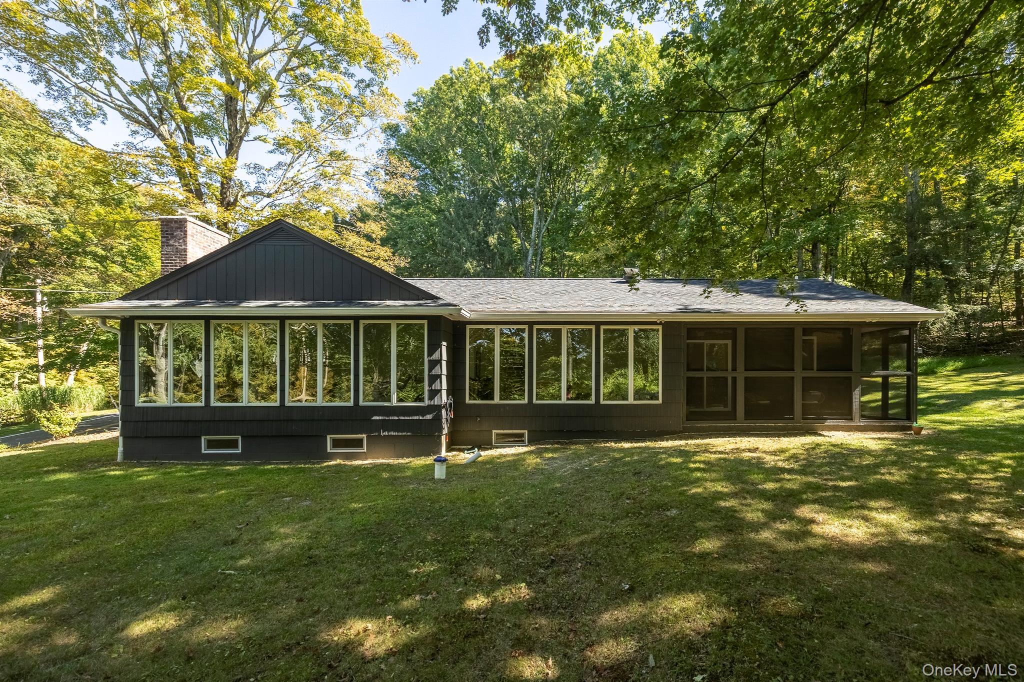 On 3.27 acres just outside the hamlet of Bangall, this beautifully updated single-level ranch offers 3 bedrooms and 2 bathrooms in a serene country setting, overlooking one of Dutchess Countyâ€™s most sought after roads. The bright and airy living room features vaulted ceilings, an impressive stone wood burning fireplace, and a wall of west-facing windows that bathe the space in natural light and offer stunning sunsets and seasonal mountain views in fall and winter. A recently renovated kitchen blends style and function, while three comfortable bedrooms provide restful retreatsâ€”one complete with a cozy reading nook perfect for quiet moments for the little ones. The two newly renovated bathrooms both feature radiant heated floors. Outdoor living shines here, with new landscaping and hardscaping showcasing Forsythia, Dappled Willow, and a graceful Weeping Cherry tree. Enjoy gatherings around the firepit, relax in the outdoor dining area, or explore the expansive and private hillside behind the property - perfect for a nature loverâ€™s walk in the woods. A screened Bluestone porch offers a peaceful extension of the home, perfect for enjoying the changing seasons and gentle breeze. Recent upgrades include a new roof (2022), insulation, water filtration, and fireplace repointing and reliningâ€”ensuring comfort and peace of mind. There is abundant storage in the basement and the garage, both with new windows. This property combines the charm of Hudson Valley living with thoughtful updates, making it an ideal full-time residence or weekend escape. Located within 20 minutes from the world-class amenities offered in Rhinebeck, Millbrook and Amenia, and all under 2 hours to NYC.