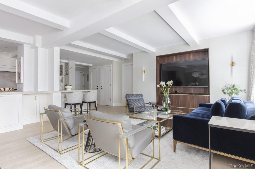 Luxurious newly Renovated Co-op in the recently developed Hudson Yards Neighborhood. Turn key unit and move-in ready! Enter timeless elegance reimagined for modern living. This meticulously renovated co-op blends classic New York charm with cutting-edge sophistication, offering a sanctuary of style and comfort in one of the city&rsquo;s most coveted neighborhoods. State-of-the-Art Chef&rsquo;s Kitchen: Custom cabinetry, Leathered Taj Mahol natural quartz countertops and backsplash, top-of-the-line appliances from Miele and Monogram, additional built-in wine fridge and also a soda fridge, and brass fixtures and hardware throughout. Spa-Inspired Bathrooms: Featuring marble floors and walls, brass Brizo fixtures, oversized rain showers enclosed in frameless glass and a deep soaking bathtub. Designer Finishes: Wide-plank white oak flooring, recessed LED lighting and sconces, motorized window treatments throughout as well as wallpaper throughout. This co-op isn&rsquo;t just a home, it&rsquo;s a statement. Owner has a real estate license in FL.