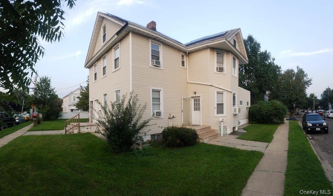 Rare investment opportunity: this spacious legal three-family home, sold with an additional adjoining lot, offers strong rental potential and modern upgrades throughout. The property features a 2-bedroom/2-bathroom unit and a 1-bedroom/1-bathroom unit on the first floor, along with a 2-bedroom/2-bathroom unit on the second floor. All apartments have been recently renovated with stylish new kitchens and updated bathrooms, while the home is further enhanced by energy-efficient solar panels. A newly built parking lot with two dry wells provides added convenience. Ideally located near the train station and other local amenities, this turnkey property presents an excellent opportunity for investors seeking both immediate income and long-term value.