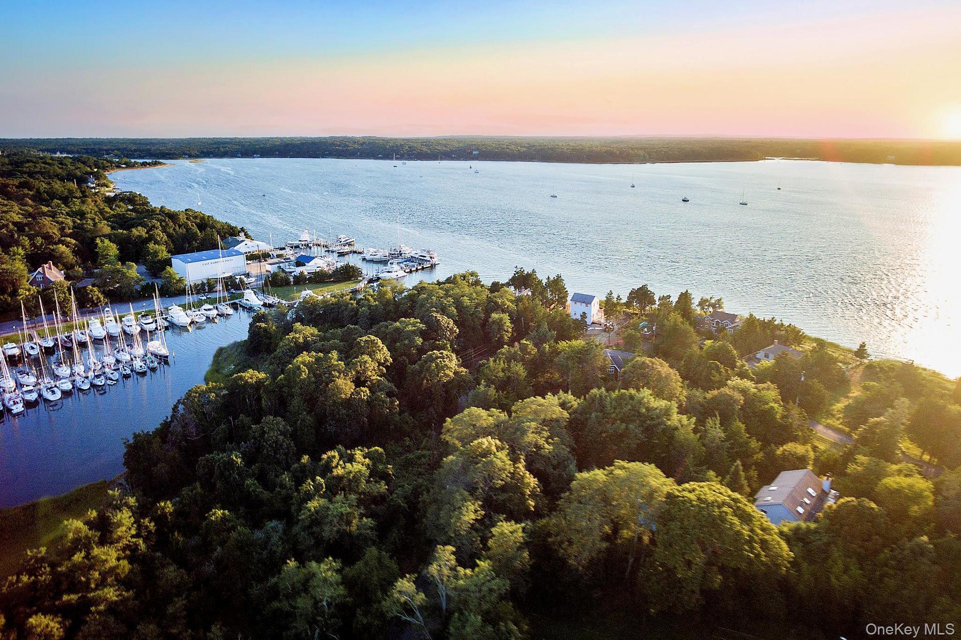 Water view on Three Mile Harbor! Enjoy the Endless Western Sunsets! Overlooking a preserve and next to the harbor, this prime water view home is on a permanently protected waterfront preserve. This quiet residential enclave is located across from a permanently protected preserve. As you face West over Three Mile Harbor, you are also adjacent to East Hampton&rsquo;s finest marinas and restaurants. Perfect as a forever home or great for a builder or investor with shy .7 acres of useable land. Set on a beautifully landscaped parcel, filled with specimen trees for maximum privacy, the house features endless sunsets, water views, and exceptional light and space. On the lower level there are three bedrooms, two baths, and media/family room. The second floor has a large living/great room, master suite and beautifully crafted kitchen with cherry wood cabinetry and granite counter tops. A large waterside deck off the living room is a gateway to all the activities of the harbor and a feast of magnificent sunsets. A 20 x 40 heated pool with ample decking, CAC and full basement add more comfort and beauty of the property. Rare and unusual, come take a look.LESS ?