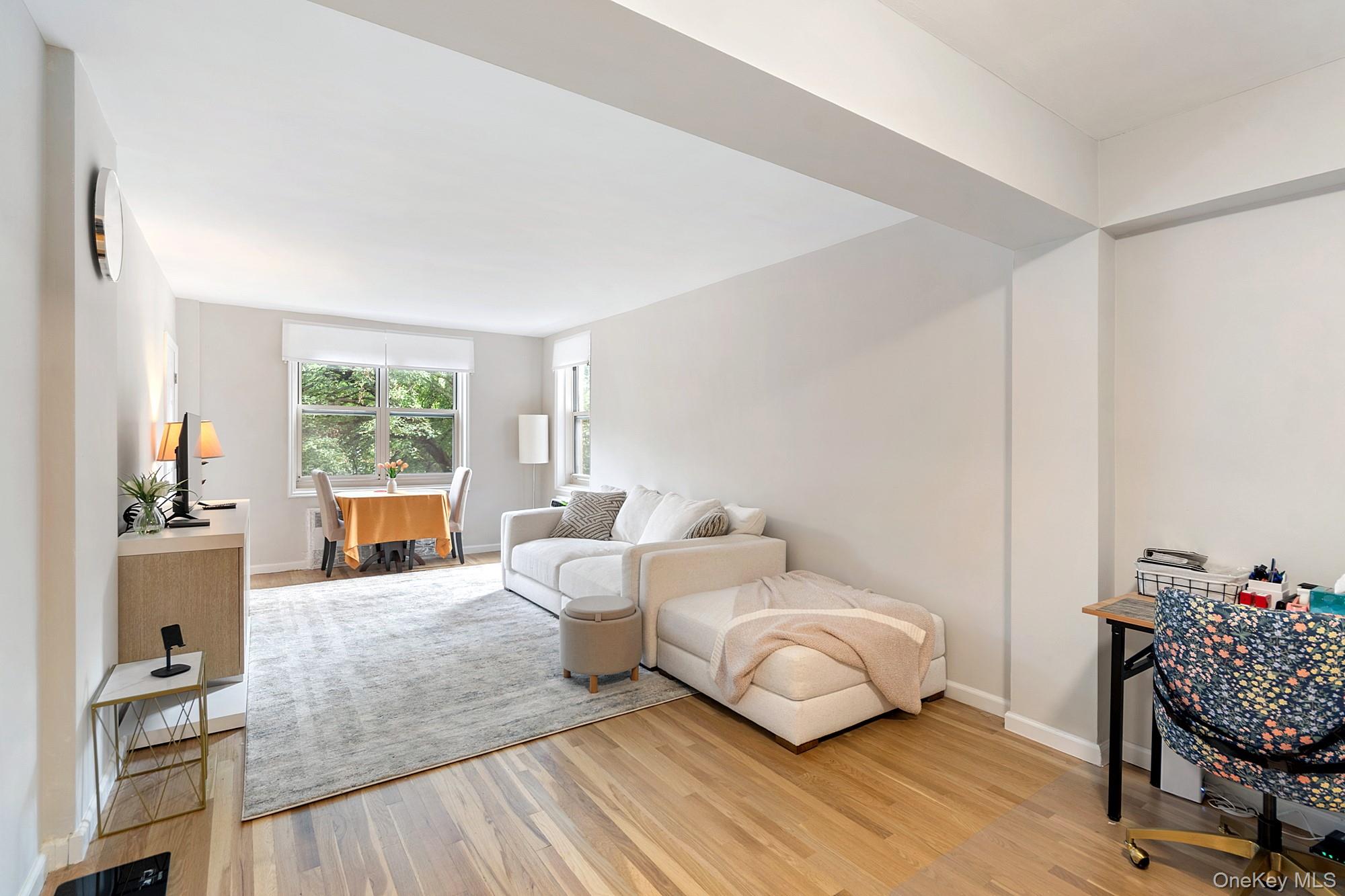 Experience elevated city living at The Bonnie Crest, a commuterâ€™s haven tucked away in the desirable Southern section of Riverdale, where comfort, convenience, and charm come together seamlessly. This expansive and fully renovated 2 bedroom has been converted from a Junior 4 and offers a flexible layout that can easily adapt to your lifestyle, whether you need a dedicated home office, a formal dining room, or a second bedroom. As you step inside, youâ€™re welcomed by a gracious foyer that leads to a spacious living room bathed in natural light, where oversized new windows perfectly frame the tranquil beauty of lush, tree-lined viewsâ€”an inviting backdrop for morning coffee, evening relaxation, or even a bit of peaceful bird watching. Gorgeous hardwood floors flow throughout, adding warmth and character, while through-the-wall air conditioners provide year-round comfort without compromising space or style. The updated galley kitchen features rich wood cabinetry, gleaming granite countertops, and stainless steel appliances, making meal preparation both functional and stylish. The bonus room off the kitchen provides endless possibilities, while the remodeled bathroom boasts modern finishes, including a granite-topped vanity and contemporary design touches. The serene primary bedroom is generously sized, offering both privacy and comfort, with large windows that bring in soft, natural light. Residents of The Bonnie Crest enjoy exceptional amenities, including onsite laundry, available parking, a live-in superintendent, and part-time door service. The location is ideal for commuters â€“ a short walk to the Spuyten Duyvil Metro North station for a 25-minute ride to Grand Central! Local buses Bx10 and Bx20 stop right outside and can take you to #1 train in just a few minutes. Manhattanâ€™s express buses BxM1 (east side), BxM2 (west side) and BxM18 (Wall St) also stop right outside. There is a shopping area across the street with a pharmacy, supermarket, deli, wine shop, cleaners and a few restaurants. 10 min walk to the Riverdale Park, an expansive 1.5-mile long park overlooking the Hudson River, perfect for long walks, runs, and light hiking - a peaceful escape from life in the city. This is an amazing value â€“ own this apartment for less than rent!