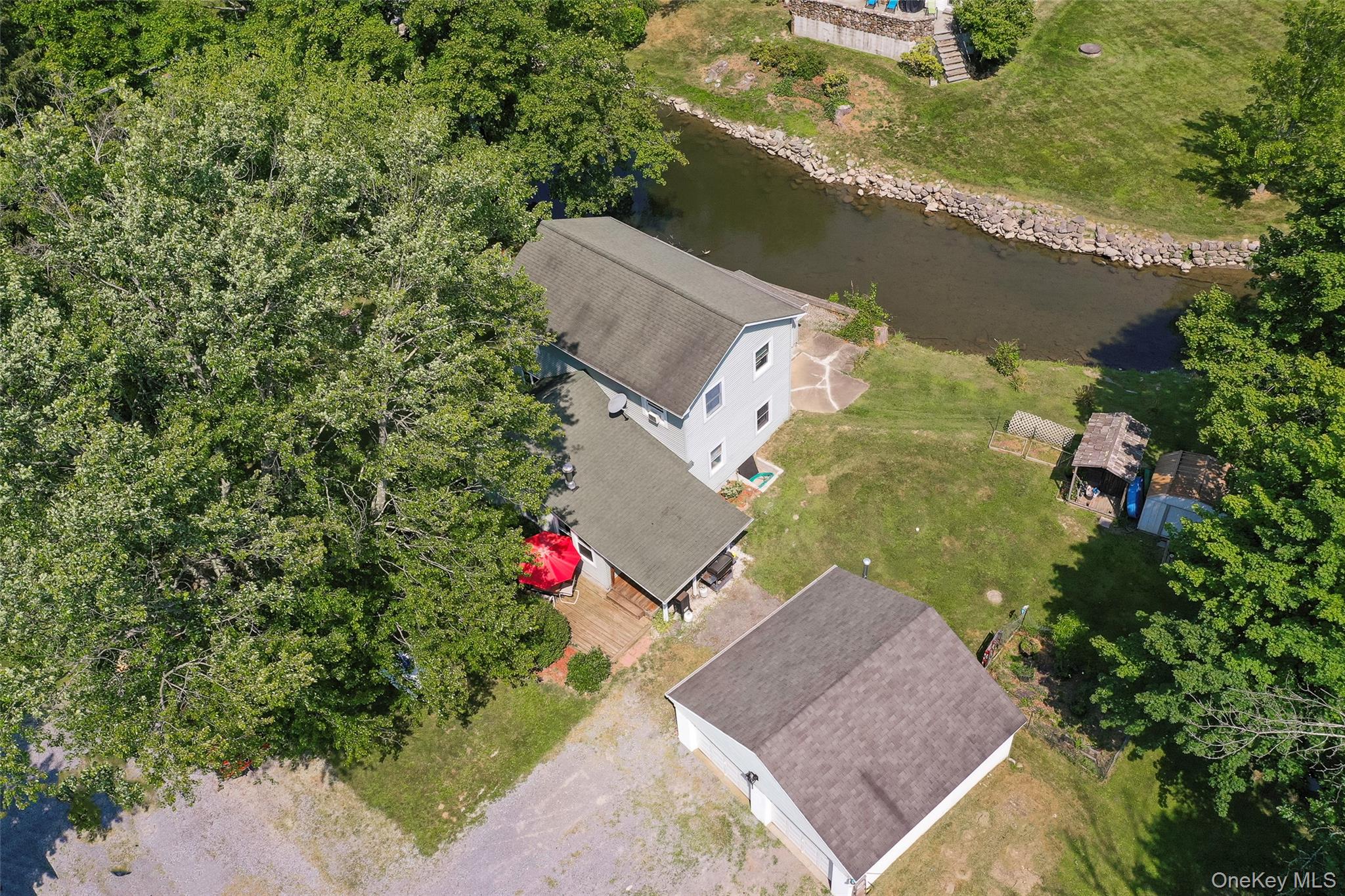 Welcome home to this charming Cape style home at 106 Skidmore Rd, La Grangeville, NY 12540 on Spout Creek with the Arlington School District. This delightful residence boasts an expansive floor plan, offering over 1, 900 square feet of versatile living space, perfectly designed for you to add your personal touches and truly make it your own. As you enter the main living level, the home offers a foyer, living room, dining room, galley kitchen, 2 full bathrooms, 1 bedroom, laundry/utility room, storage room, and mud room.&#160; 2nd living level offers 3 large bedrooms and an office/den. All is situated on almost an acre of land with a detached 2-car garage.&#160; Location is everything, and this home is ideally situated just under five minutes from the Taconic State Parkway, providing easy access to nearby areas. The Metro North Railway is a mere 20 minutes away, making commuting a breeze. You&rsquo;ll find yourself conveniently close to the myriad of amenities that the picturesque Hudson Valley has to offer. Explore the charm of nearby towns, indulge in local dining experiences, and sample the delightful offerings from wineries, cafes, and farm-to-fork eateries. For those who love the outdoors, the region is abundant with recreational activities, including hiking, biking, walking trails, and water sports, ensuring that adventure is always just around the corner. Embrace the Hudson Valley lifestyle that so many have come to cherish and make this beautiful home your own. Whether you&rsquo;re looking for a place to call home or an investment opportunity, this home has endless possibilities. Come and discover the life that awaits you in this wonderful Hudson Valley!