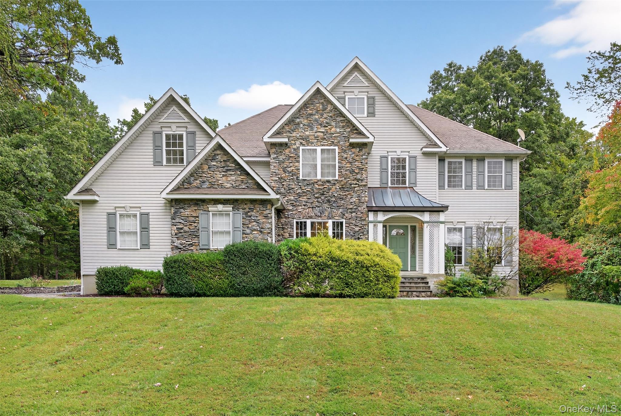 Set on two beautifully manicured acres just minutes from the Taconic, this move-in-ready home offers space, privacy, and polished comfortâ€”inside and out. The property is thoughtfully landscaped with mature trees offering shade, while open lawns invite play, entertaining, or quiet enjoyment of the outdoors. Out back, a wide deck leads to a pool, creating a private escape framed by nature.Inside, the kitchen takes center stageâ€”fully remodeled in 2019 by Kingwood Kitchens, with rich cabinetry and sleek modern finishes. A double-sided fireplace connects the living room to a custom home office with built-in shelving and storage, creating flexible space that works as hard as it relaxes. Upstairs, the primary suite offers generous proportions, including a walk-in closet with a hidden bonus room tucked behind it.A whole-house alarm system and underground dog fence add smart functionality to this thoughtfully designed home. A rare blend of usable land, upgraded interiors, and understated luxuryâ€”189 Reilly delivers it all.