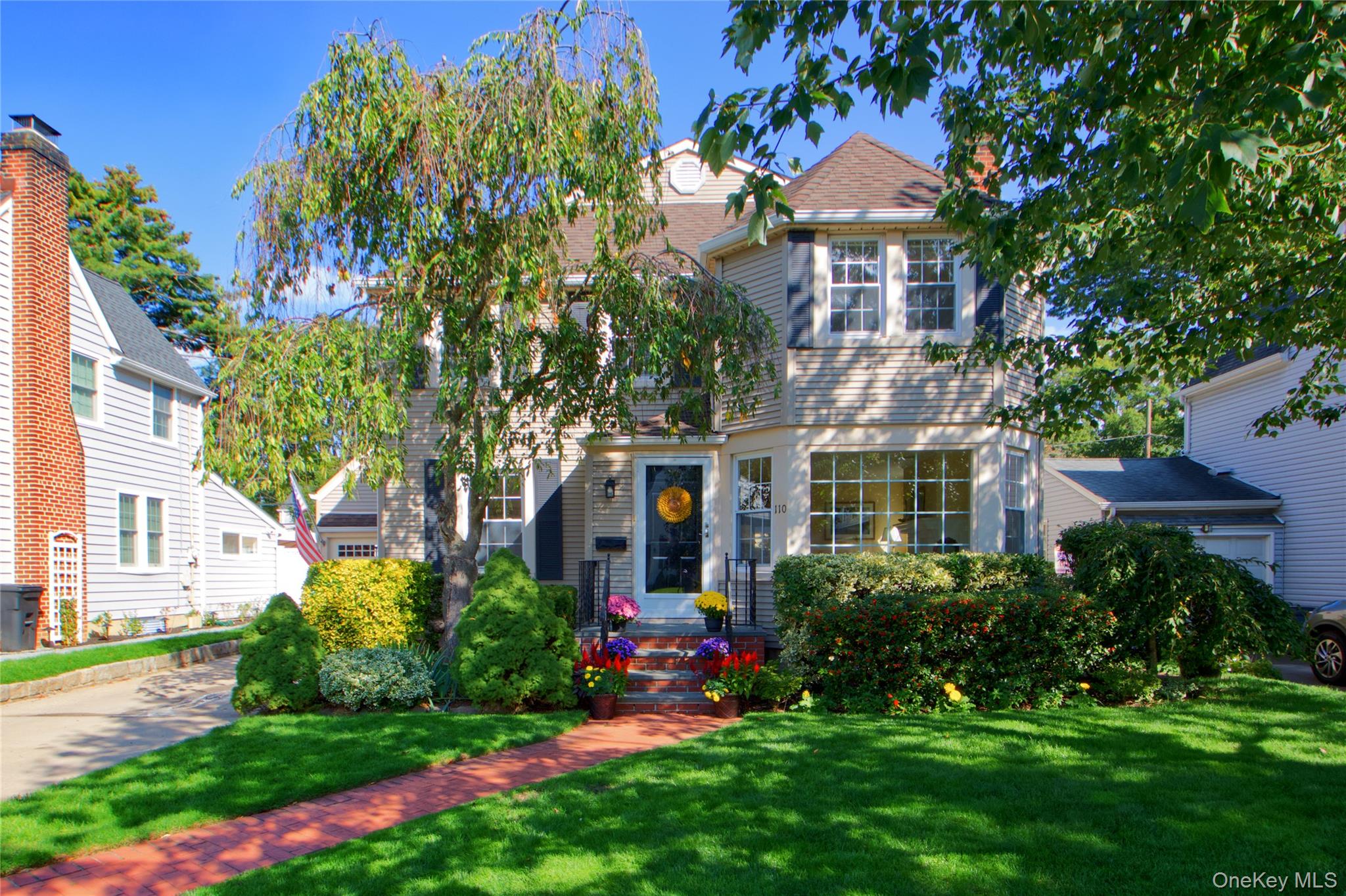 Lovely Dutch Colonial Located In The Village Of Stewart Manor Within The Garden City School District Offers 5 Bedrooms, 3 Full Baths And Central Air. Charming Entry Foyer Is Welcoming To The Sun-Drenched Living Room With Fireplace And Hardwood Floors. Formal Dining Room With Adjacent Bar Area Leads to Spacious Eat-In Kitchen With Stainless Steel Appliances And Large Pantry Closet. Breakfast Area With Bay Window Opens To Lovely Family Room With Sliding Doors To Exterior Deck And French Doors Flowing Seamlessly Back To The Living Room. Full Bath Completes The First Floor. Perfectly Situated Staircase Leads To Second Floor, With Its 5 Spacious Bedrooms And 2 Full Baths, One En-Suite. Magnificently Landscaped 50 x 100 Lot With Attached Garage. Laundry In Basement, With Plenty Of Storage And The Mechanicals. Natural Gas Connected With Oil For Heating. Very Convenient To LIRR Stewart Manor Station, Shops And Dining. A Must See Which Will Not Last.