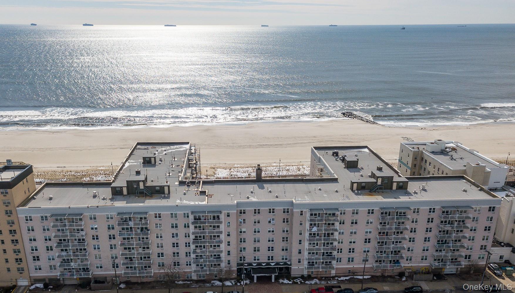 Spacious & Sunlit Junior 4 WITH DEDICATED PARKING, featuring a unique layout, in a premier Long Beach Oceanfront building! Perfectly priced and perched on the 6th floor, this updated, modern unit offers a bright, open layout. Enjoy sweeping city views, picturesque Long Beach vistas, and magical summer sunsets right from home. Inside, youâ€™ll find ceiling fans, abundant closet space and a versatile floor plan allowing for a flexible dining area, office, or guest space. Dedicated parking is included for ultimate convenience! This sought-after oceanfront building offers unparalleled amenities: a heated 22-yard oceanfront pool, a large and fully equipped gym, a party room with a full kitchen, storage for bikes, surfboards, beach chairs, and umbrellas, plus direct access to the boardwalk and Atlantic Ocean. Thereâ€™s even a secure package room with video monitoring â€” including handling of returns. Experience the best of Long Beach living with comfort, style, and unbeatable location just moments from the sand.