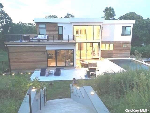 This absolutely stunning contemporary home is the perfect place for your North Fork getaway! Features galore include a chef&rsquo;s dream eat in kitchen, spacious living room with gas fireplace, and 3 available bedrooms. The first floor primary suite is enormous, with a soaking tub as well as shower in the gorgeous bathroom, plus a connected additional bedroom. The 2 guest suites, one with 2 queen beds, have their own beautiful bathrooms plus a there&rsquo;s a TV in every bedroom. Step out to the backyard paradise, with luxurious pool, cushy furniture, large dining table and firepit. Swim, relax, or enjoy the sunset at Iron Pier beach, just a block away, or visit the nearby farm stands or golf courses. You will not be disappointed!, Available off season and seasonal.