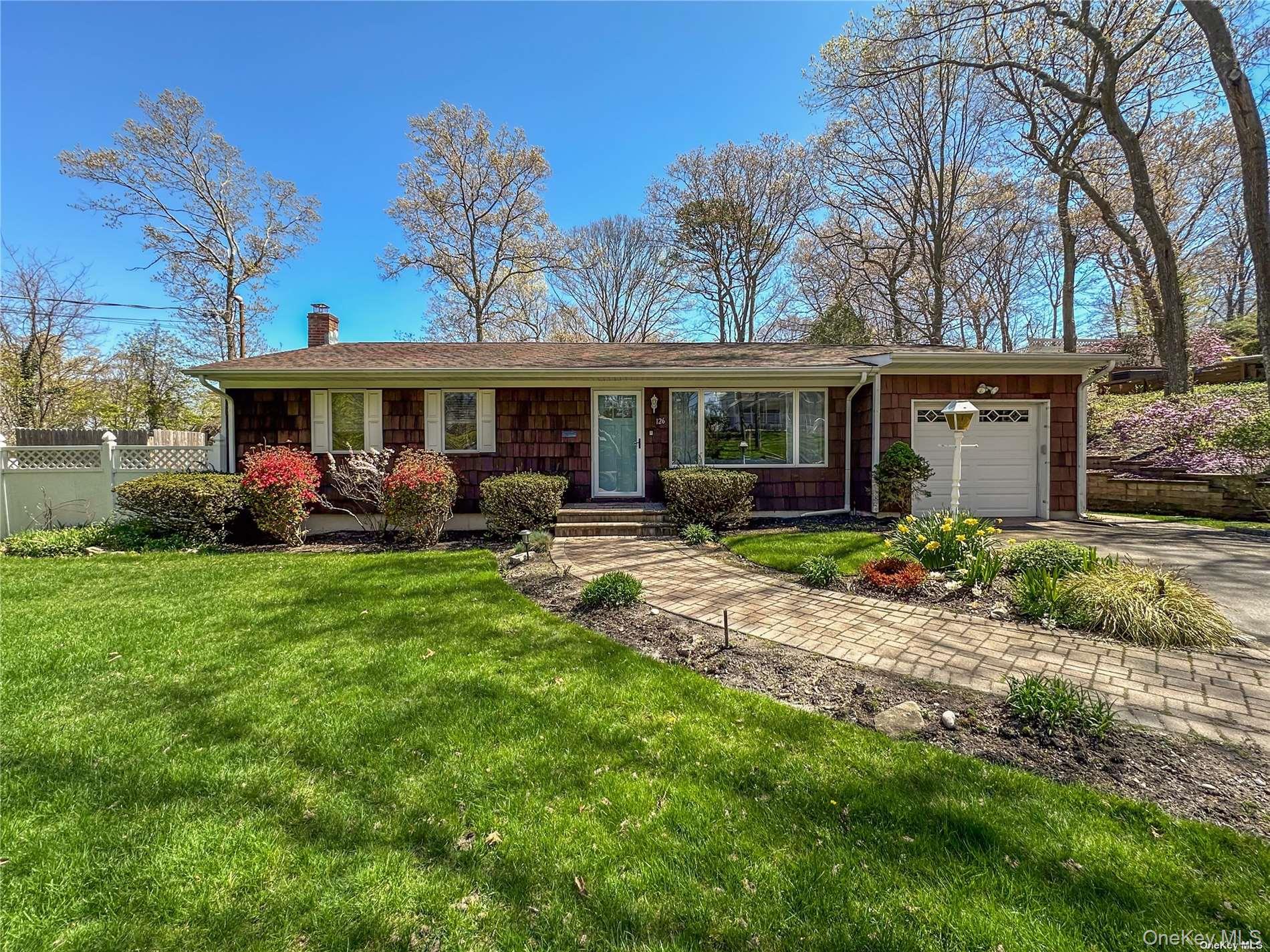 Immerse yourself in the quintessential North Fork lifestyle! Situated on a spacious lot on a charming street, this exquisitely updated ranch offers a plethora of amenities to elevate your summer experience. Enter into an expansive open-concept living area adorned with lofty ceilings and abundant natural light, seamlessly flowing into a well-appointed eat-in kitchen with a central island table and stainless-steel appliances. The primary bedroom down the hall boasts a queen bed and an en-suite half bath, while the secondary bedroom features a full bed and a versatile office desk, ideal for remote work. The third bedroom is furnished with two twin beds. A beautifully renovated full hallway bathroom completes this wing. Descend to the finished lower level, where a generous TV/lounge area awaits, alongside an additional sleeping alcove with a queen bed, a fully updated bath, and a conveniently stocked laundry room. Outside, the exceptional yard beckons with a spacious patio, multiple seating areas, a BBQ, and an outdoor fireplace. Discover an additional fire-pit area and a generously sized fenced-in pool with a trellis lounge area, offering endless opportunities for outdoor relaxation and entertainment.  Conveniently situated just moments from a charming downtown area, golf courses, vineyards, and farm stands, this home also provides easy access to the beautiful Wading River Beach, the perfect backdrop for enjoying the serene coastal lifestyle. June $10k July $14k Aug-LD $18k. Extended/Off Season also considered.