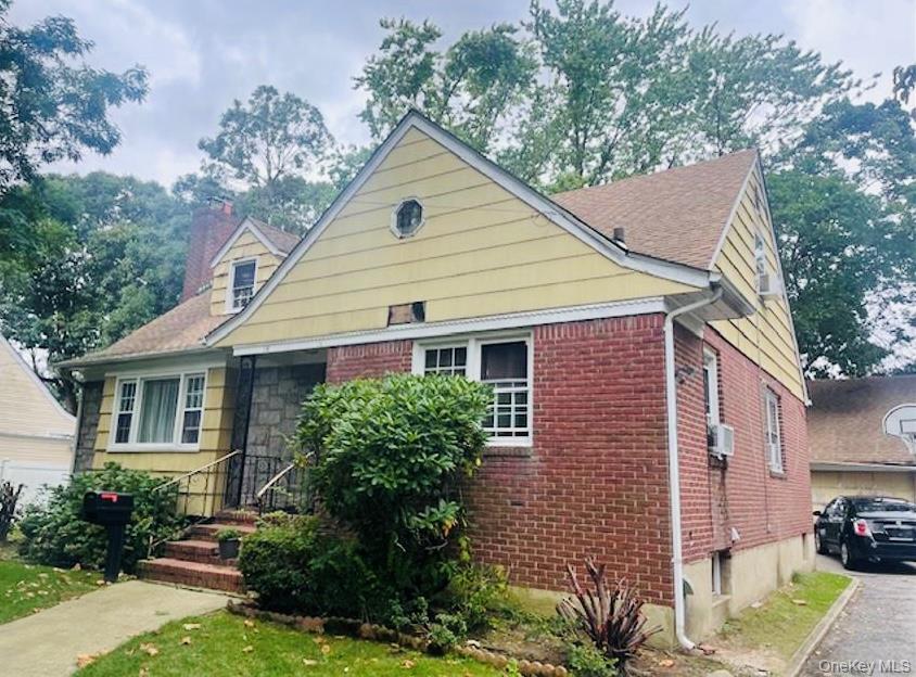 Single-family Colonial style home. The property contains 2, 087+square spread over 3 levels, including a finished basement with interior and exterior access. The home is frame/brick construction with asphalt shingle roof, cedar shingles siding and double hung aluminum windows. The home consists of bedrooms, two full bathrooms, a kitchen with original appliances and a living room with an arched entry way and a wood burning fireplace. The property also boasts a detached 2 car garage. Some upgrades needed to uncover this gem. The property has a efficient layout to accommodate your growing family.