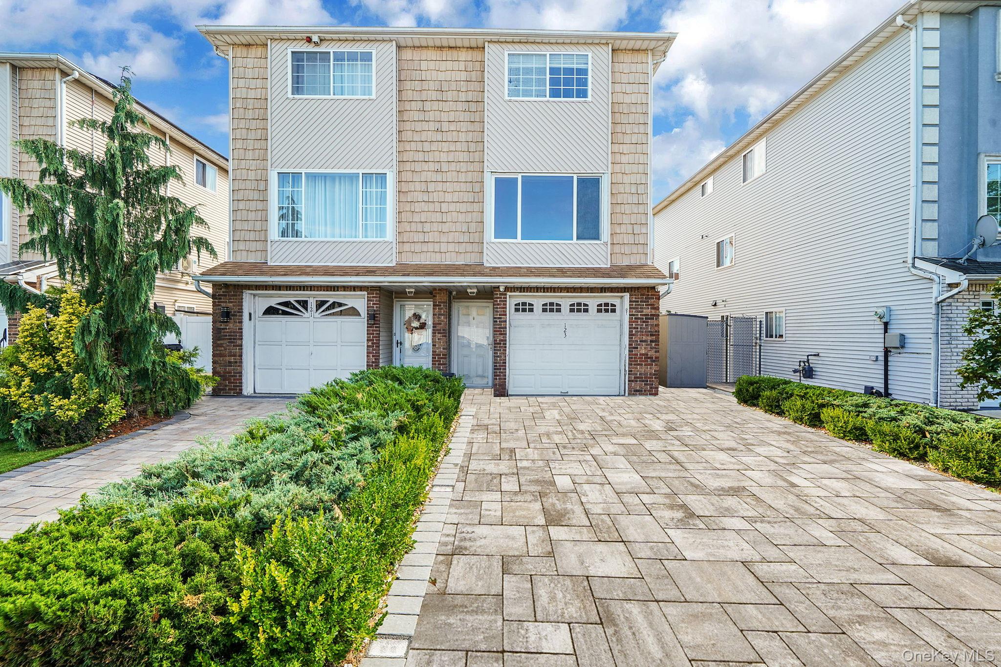 Welcome to 123 Amity Place, a beautifully maintained multi level home offering exceptional flexibility, modern comfort, and abundant living space. Perfectly positioned in one of Staten Islandâ€™s most convenient neighborhoods, this residence is designed to grow with your family while also providing versatile options for todayâ€™s lifestyle.This home spans three levels with an intuitive floor plan that feels both spacious and functional. On the main floor, the bright open kitchen features modern cabinetry, stainless appliances, and an easy connection to the dining space, making everyday meals and special gatherings equally enjoyable. The large living and dining room is bathed in natural light, highlighted by gleaming hardwood floors and a seamless flow ideal for entertaining. Upstairs, youâ€™ll find three well sized bedrooms, including a king sized primary retreat, plus ample closets that make storage a breeze. An attached garage adds the practicality of secure parking and additional storage.One of the standout features of 123 Amity Place is the bonus separate entrance suite, currently configured as a studio apartment with bathroom. This flexible space is perfectly suited for extended family, a private guest retreat, or even a home office setup. Whether you choose to embrace one expansive home with multiple living areas or prefer dual living opportunities, this property provides the adaptability todayâ€™s households truly need.The outdoor spaces are just as inviting, with a private backyard and deck offering the perfect setting for summer barbecues, casual gatherings, or simply enjoying a quiet moment outdoors. With multiple entrances, sun splashed rooms, and spaces that can easily transform to fit your needs, this home offers a balance of functionality and charm that is rare to find.Located in a welcoming Staten Island enclave, 123 Amity Place combines suburban comfort with excellent convenience. The home is just minutes from shopping, restaurants, and daily essentials, while offering easy access to public transportation, major roadways, and the Staten Island Ferry, providing a quick connection to both Brooklyn and Manhattan. Families will also appreciate the proximity to schools, parks, and recreational amenities, ensuring that everything you need is close at hand.This home proudly presents a property that blends flexibility, comfort, and long term value. Whether you envision it as one large home or a residence with multiple living arrangements, this address is ready to meet your vision. 3d tour doesnâ€™t show additional studio space.