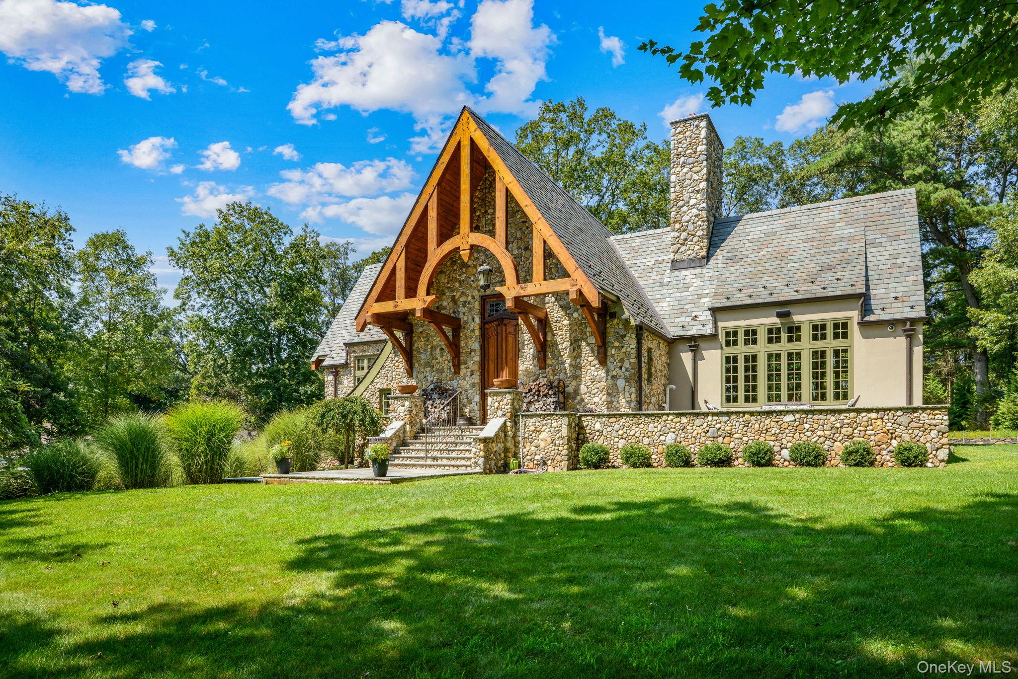 Once upon a time, a visionary builder poured his passion into creating not just a houseâ€”but his kind of castle. With meticulous care, he selected every material, every craftsman, and personally oversaw each detail. The result? A stately, timeless residence that stands as both a dream fulfilled and a legacy preserved. Come and See how Amazing and Beautiful this one of a kind home truly is. Both Buildings have Vermont Slate Roofs, that will stand the test of time.The Feeling as you Enter through the Sturdy European Double doors, then the walk through to the Living Room, Dining Room, Kitchen & Sunroom takes your breath away,  your eyes can&rsquo;t absorb all they are seeing. The Primary Bedroom EnSuite is a Sanctuary with Stately Bathroom with Soaking Tub, Separate Shower, Walk In Linen Closet, 1st Floor Laundry and Juliet Balcony. The Center Island Kitchen is the Heart of this Home and has Top Shelf Appliances, including a Bertazzoni Stove/Oven, Sub Zero Frig, Cabintry Galore and Counterspace that will awe any Chef. The Dining Room and Living Room focus is the Floor to Ceiling Woodburning Stone Fireplace, hand crafted by a 3rd Generation European Stone Mason, .....Santa will be proud to slide down that Chimney and fill all the Stockings hung there during the Holidays. Sunlight spills into the bright sunroom, the perfect spot for morning coffee, a good book, or a recharge on gray winter days. The Lower Level is Ground Level and has 3 more bedrooms and a full bathroom, & storage areas. There is also a Dressing room, that captures the Essence of a High-End Boutique, creating a one of a kind space for your Personal Clothes Collection! This level is a private and has a separate entry opening the possiblity for a Multi Generational living space, or a Haven for Teenagers. The Mechanical Room will Impress even the most Tech Savvy......Radiant Heat, Specialty Boiler, Water Heaters and Systems that the Owner will give Tutorials on. The 3 car Garage Has A Professional Lift, Making it the perfect Haven for Car Enthusiasts and Collectors alike. Over the Top with Details and Unique Building Materials........This Home proudly sits on 1.9 Acres is Sooooo Magical and Will Excite your Heart and Soul !!!! What was a Dream and Now is a Reality, that took a very Special Man Years to Skillfully Orchestrate, is just to know this Multi Faceted Man and See & Feel the Legacy he Created!!!!