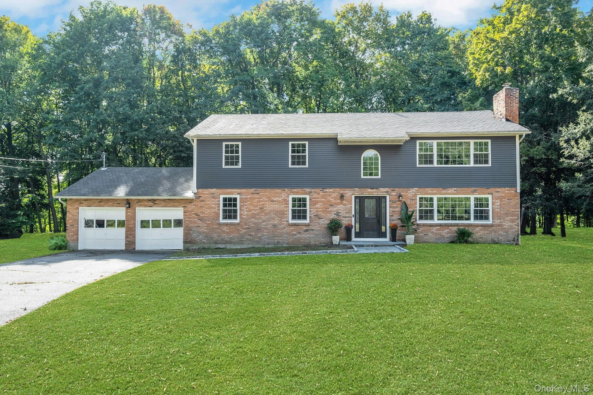 Tucked away on a quiet cul-de-sac in the picturesque town of Katonah, this beautifully updated five-bedroom, four-bath home sits on over an acre and offers more than 3, 000 sq ft of open-concept livingâ€”perfect for entertaining or everyday comfort. Step into the foyer beneath a grand chandelier and into the heart of the home. The chefâ€™s kitchen is a delight, with an oversized quartz waterfall island, seating, a second sink, microwave, beverage fridge; and all-new Thermador appliances, including a pot filler to cook with ease. Ample cabinetry and a walk-in pantry keep everything organized, and just beyond is the dining area with wood-burning fireplace, which brings warmth and charm. Relax and unwind in the living room, complete with oversized windows and French sliding door leading to the backyard the newly built bluestone patio (September 2025), allowing easy access to the backyard for effortless indoor-outdoor living. The generous windows throughout the house allow the natural light to stream in and create a bright and airy feel. Additionally, a first-floor bedroom and full bath provide ideal accommodations for guests or an au pair. Upstairs, convenience meets luxury with a second-floor laundry room, four additional bedrooms and three full bathrooms. The sprawling primary suite is a true retreat, complete with a walk-in closet, a luxurious en-suite featuring a double vanity, a classic clawfoot tub, separate shower, and direct access to a private deck. A second bedroom also has an en-suite bathroom and walk-in closet, and there are two additional bedrooms on the second floor. Peace of mind comes with extensive updates: a new Camelot roof, windows, siding, plumbing, electrical, well system, and efficient Bosch heat pumps with propane backup. With a two-car garage, expansive yard, and tranquil tree-lined setting, this turn-key Katonah gem is ready to welcome you home.