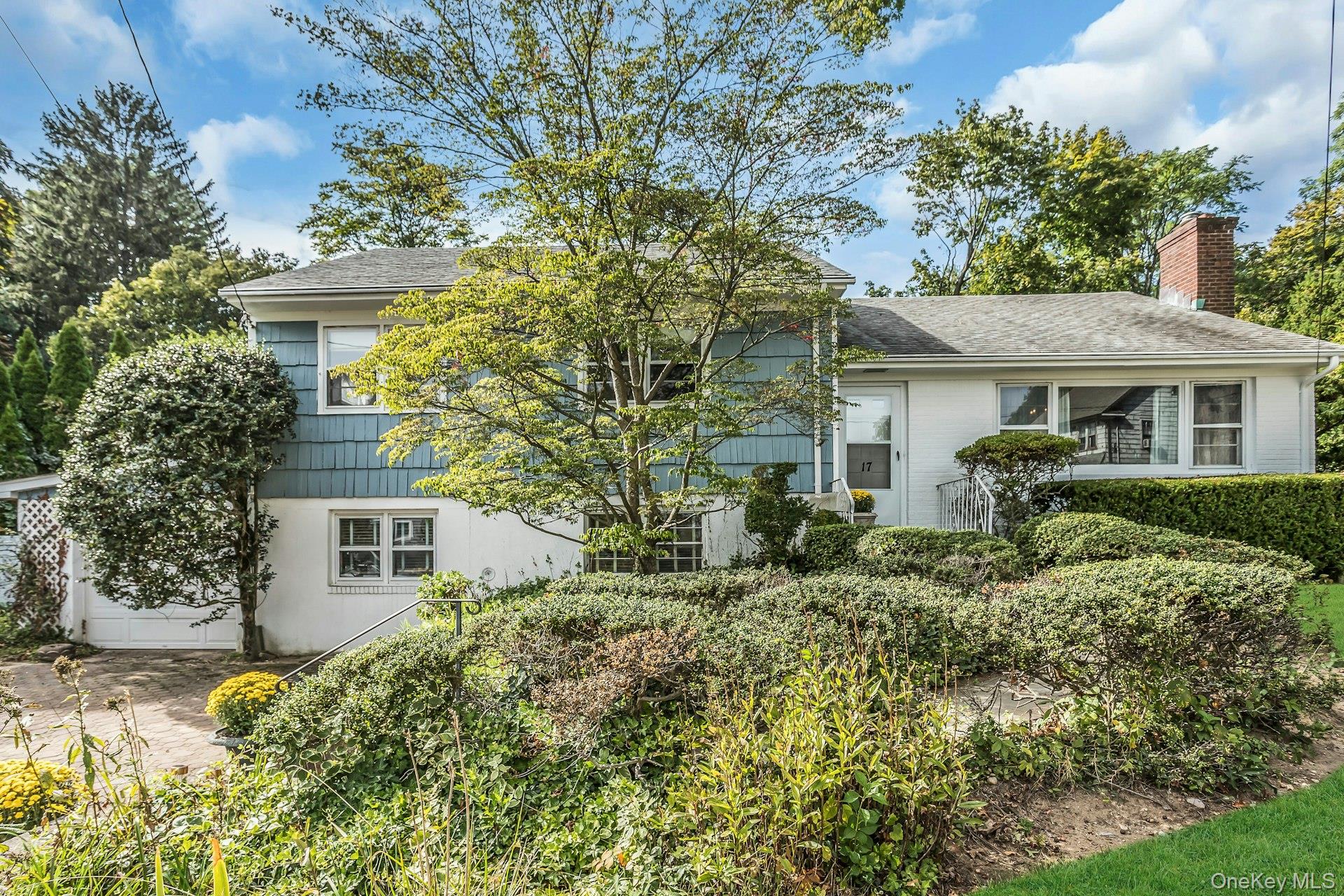 Available for the first time in over 50 years, this village home is located in the heart of downtown Locust Valley. Offering both the easy access to local shops, restaurants, and train to New York City, but also the peacefulness of a quiet street. This split ranch has four bedrooms, three on the main level and a den and fourth bedroom on the lower level that offer extra privacy for guests or extended family. The enlarged to eat-in kitchen is full of light with a cathedral ceiling dining area, overlooking the pool and garden. The basement consisted of two rooms, a large open laundry area with storage and a separate workshop.