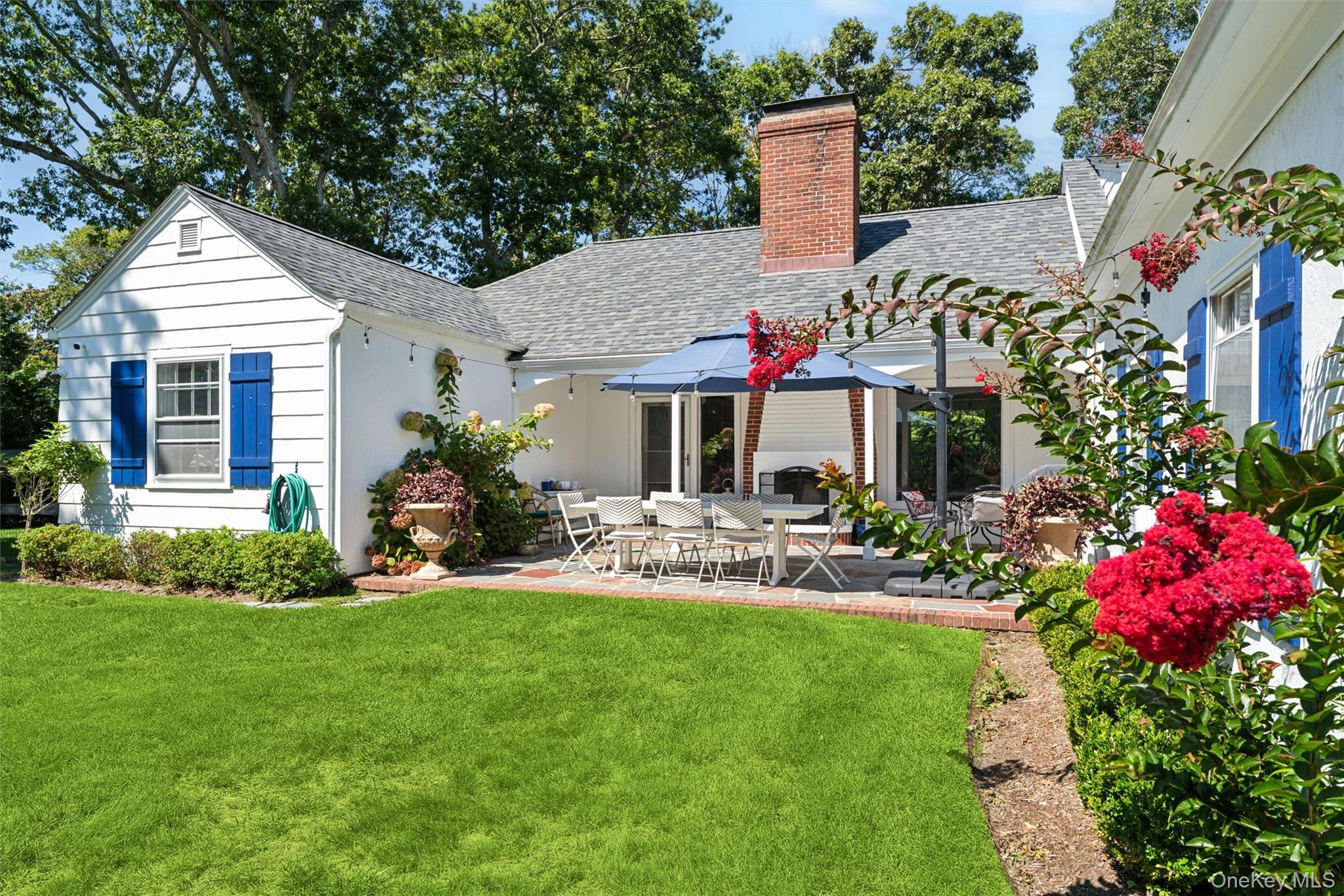 CHIC QUIOGUE BEACH COTTAGETucked away on a quiet cul-de-sac in Quiogue, less than a mile from Westhampton Beach&rsquo;s Main Street, this recently renovated cottage blends comfort, convenience, and contemporary style. On the main floor there&rsquo;s a sunny living room with high ceilings and a wood-burning fireplace; a cozy kitchen; and an oversized first-floor primary suite with spa bath and walk-in closet. There&rsquo;s also a separate office with its own full bath, and a guest wing with two guest bedrooms and shared bath. Upstairs there is additional living space and another full bath. Outdoors, enjoy wide green lawns and a flagstone terrace with dining area and a second wood-burning fireplace-perfect for relaxing or entertaining on summer evenings. Available for summer vacations or off-season stays, this cottage is the ideal rental retreat, close to everything the Hamptons have to offer!