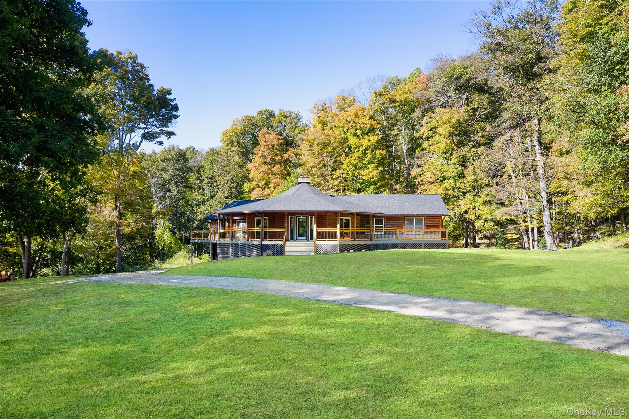 Millbrook Modern Log Home on Nearly 3.5 Private AcresTucked away on rolling, private property, this bright and airy genuine log home has been completely reimagined and restored from top to bottomâ€”inside and out.Step inside to find a floor-to-ceiling wood-burning fireplace, an open-concept layout, and abundant natural light throughout. Every room has been fully renovated, with reinforced structural elements and a thoughtful redesign to enhance flow and functionality.The cookâ€™s delight kitchen features new quartz counters, a butcher block island with seating, subway tile backsplash, and shaker-style cabinetry with modern hardware. The kitchen flows in the dining area and large Great Room.The home offers 2.5 beautifully renovated baths, including a primary suite with radiant heated floors, a spacious walk-in closet, and a private main-floor wing. The guest wing includes two additional bedrooms, a full bath, and convenient main-floor laundry.Additional highlights include:Durable LifeProof high-traffic flooring throughout-New ultra high-efficiency Mitsubishi Hyper-Heat HVAC system (heat & A/C) with 5-year warranty-New high-efficiency heat pump water heater-New roof, front porch flooring, stairs, and custom iron railings-New French doors leading to a spacious rear deck overlooking the serene yard and woods-Refinished basement ready for future living space and a large garage-Extensive hardscaping with bluestone patio and firepit-New perennial landscaping, new septic tank and lines (5-year warranty). Relax on the wraparound covered front porch or gather around the stone patio under the stars. Every inch of this home has been thoughtfully restored, freshly painted and stained inside and out, so you can simply unpack and move in.Perfectly situated just minutes from the enchanting Village of Millbrook, with easy access to the Taconic State Parkway and Route 82. This private retreat is ideally situated to enjoy all the Hudson Valley has to offerâ€”vineyards, farm-to-table dining, rail trails, antique shops, and more. Showings by confirmed appointment only. Home is not visible from the road.