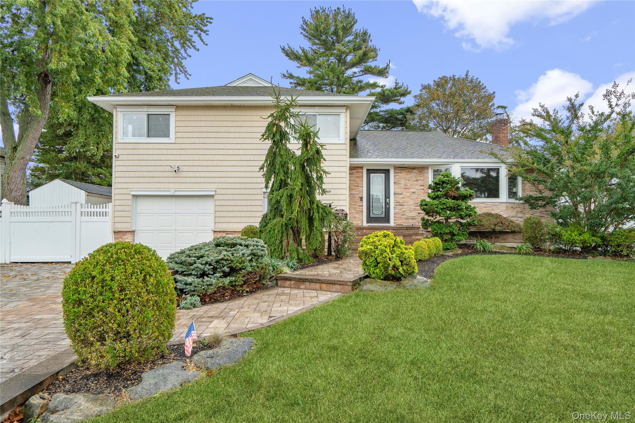 Stunning Cadillac Split in Plainedge Schools. Curb Appeal Starts with the professional Landscaping a strategically sculpted curve in the stoop, with amazing double Driveway with Cambridge pavers & pillars for lights. Accent Stone on front of home with Cedar Looking Vinyl Siding. Completely Updated in the last 15 years. Enter this home and be impressed by the soaring ceilings throughout the living space. Bright & Airy with open concept living. Gorgeous Hardwood Floors, Central Air, HI-hats & amazing Curved Pella windows in special places in home. Enjoy this kitchen with your center island, plenty of cabinet space, pantry, Stainless appliances, Gas cooking with Slider doors to entertainerâ€™s yard. Primary Bedroom has its personal primary bathroom & walk-in closet. Separate Den is a big as a dance club with tiled floors and wood-burning fireplace. (use to be a guest quarters with den, bedroom, garage in this space-easily can get converted back if desire). Basement has plenty of storage. Yard is Serene and peaceful with Cambridge Pavers and room for pool.