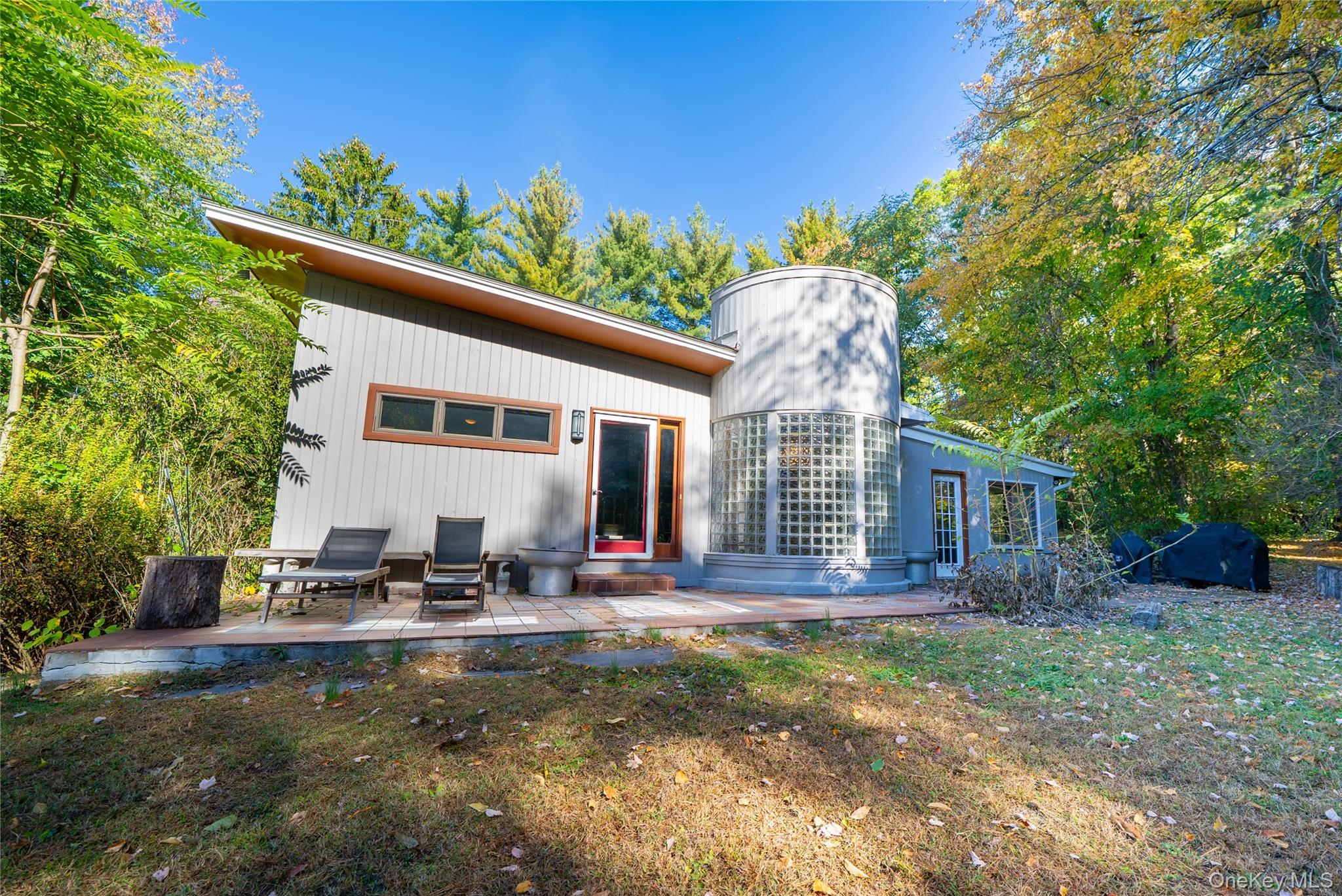 This one-of-a-kind mid-century modern home blends sleek design with natural beauty. Expansive glass walls, clean lines, and an open layout create a light-filled space that feels timeless and inspiring. The dramatic great room features a floor-to-ceiling brick fireplace, while the modern kitchen offers stainless steel appliances, abundant cabinetry, and a striking glass-block accent wall. The primary suite is a true retreat, complete with vaulted ceilings, a spa-like bath, and a custom Finnish sauna overlooking the woods. Enjoy flexible finished space on the lower level and a level yard perfect for entertaining or peaceful weekends. Conveniently located near Beacon and New Hamburg Metro North stations, I-84, and the Taconic Parkway â€” under 90 minutes to NYC. Whether youâ€™re expanding your real estate portfolio or looking for a standout home to call your own, this property delivers both style and upside.