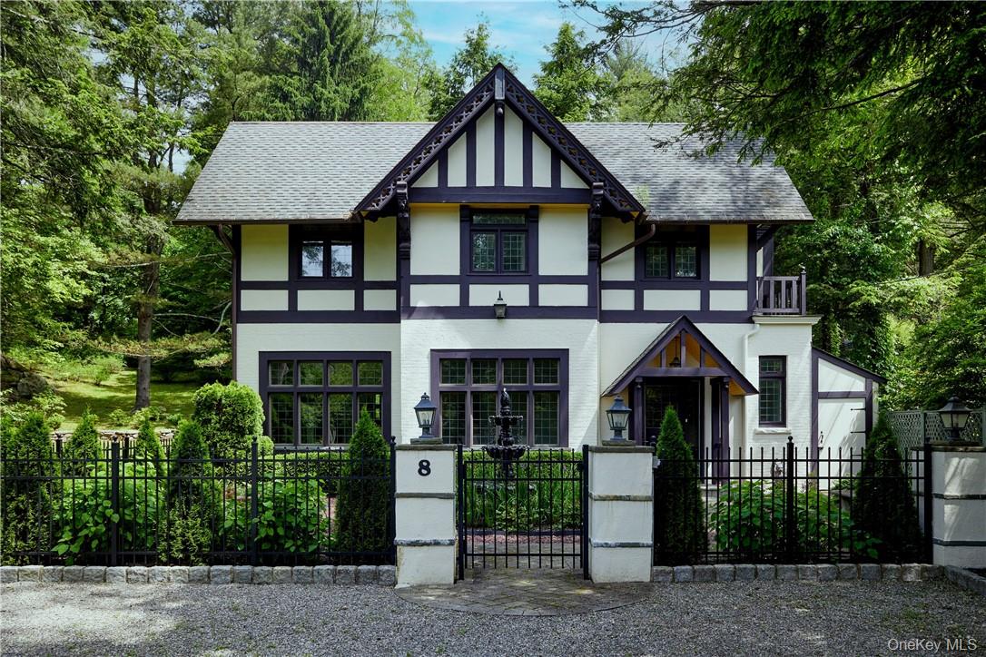 A modern renovated, historic 4-bedroom Tudor cottage within the gated Village of Tuxedo Park NY. The home is set on an oversized level yard with mature trees, picturesque boulders, bushes, plantings and 2023 refreshed classic French garden with plantings and a tiered fountain at the entrance of the home. The home offers over 2, 600 sq. ft. in a bucolic park-like setting, set back from the road. Inside the home, you find 11ft ceilings on the first floor, countless original architectural details, including hardware, doors and windows. The open floor plan includes a spacious living room with very large windows that allow so much light, and a wood burning fireplace, a casual dining area, and a chef&rsquo;s kitchen. Side doors leading to two beautiful entertaining patios and a side lawn. The primary bedroom has an en suite bathroom and four closets. Two additional bedrooms share a hall bath. There are ample closets and storage and laundry room on second floor. A fourth bedroom on third floor has its foyer and full bathroom. Central Air Conditioning throughout second floor. Full unfinished basement and a walk-in attic allows for ample storage. Driveway able to hold 4+ cars. ***Available for sale or rent. Please inquire.***