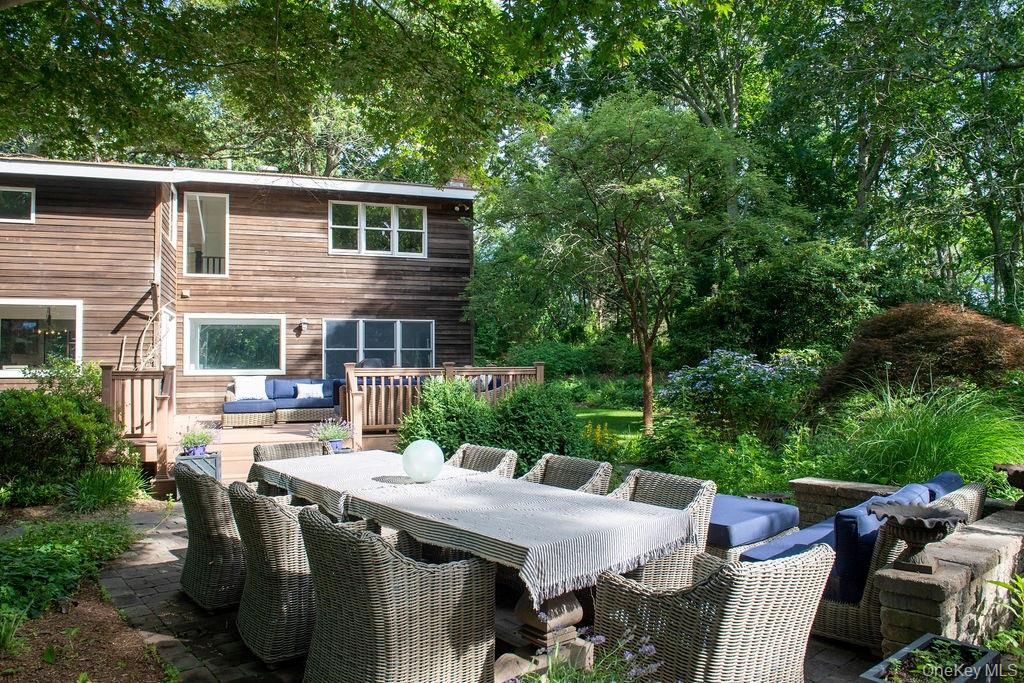 Cutchogue, North Fork â€“ Year-Round Designer Home in Arboretum SettingExperience year-round living in this fully furnished designer home, tucked away in a lush, arboretum-like setting in the heart of Cutchogue. Thoughtfully curated and impeccably maintained, this residence offers a seamless blend of style, comfort, and natural beauty. The open-concept floor plan provides expansive living and entertaining spaces, ideal for both quiet relaxation and lively gatherings.The home features three beautifully appointed bedrooms, including a spacious ownerâ€™s suite with a private en-suite bath. Two additional bedrooms share a well-designed full guest bath, while a separate powder room adds convenience for visitors. Every room is fully furnished with high-end pieces chosen for both aesthetics and comfort, creating a truly move-in-ready retreat.A modern, fully equipped kitchen opens to generous living and dining areas, all framed by large windows that bring the outdoors in. On-site laundry adds to the ease of everyday living, and pets are considered on an individual basis.Perfectly situated close to all the North Fork has to offerâ€”renowned wineries, farm stands, beaches, and charming village shopsâ€”this home is a rare opportunity to enjoy a private, design-forward lifestyle in one of Long Islandâ€™s most sought-after communities.