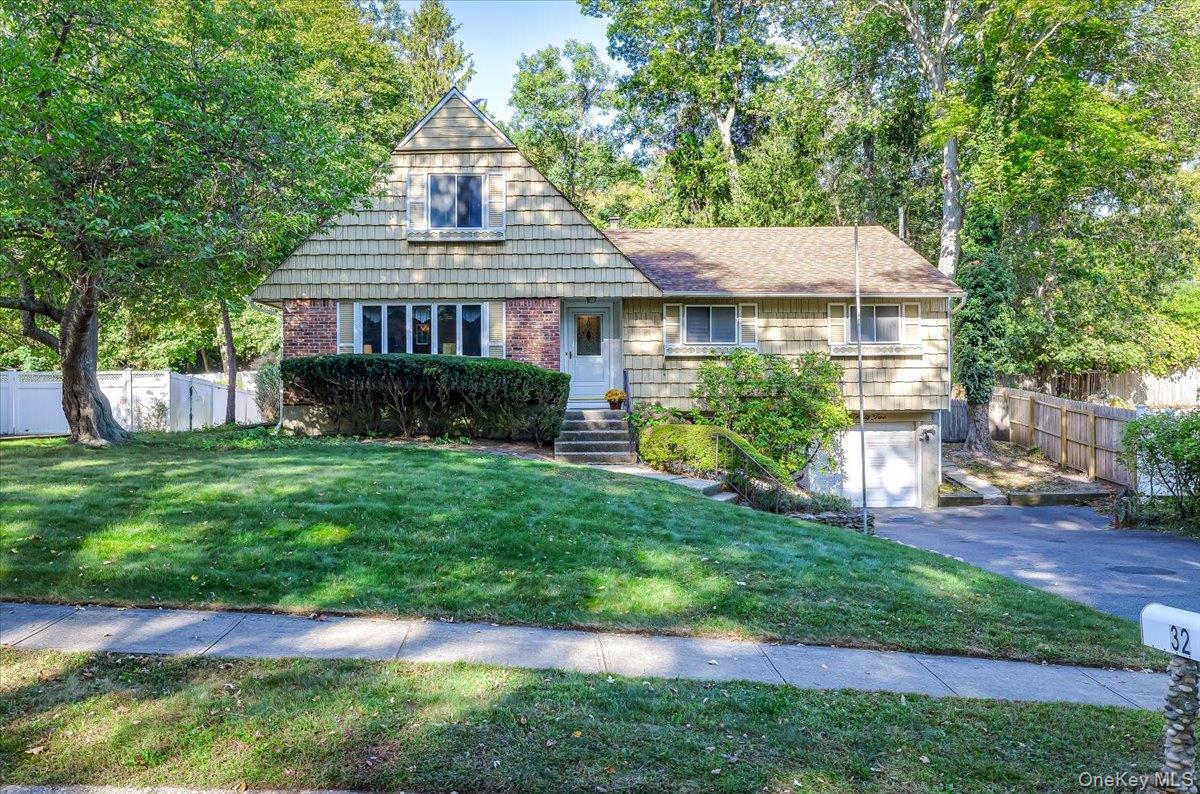 This warm and inviting 5 bedroom, 1.5 bath farm ranch home is located on .26 acres in beautiful Kings Park. It features open concept living room and dining room. The spacious eat in kitchen with new faux wood luxury vinyl flooring, offers a cozy wood burning fireplace, and leads to a wood deck with private backyard, perfect for entertainment! All three first floor bedrooms have wood floors under the carpets, one of them being the primary bedroom which offers an ensuite powder room. There is also a full bathroom with tub on the first floor. The second floor boasts freshly painted bedrooms. The large hall storage space/ closet is perfect for a possible future conversion to a bathroom. This second level would be great as a primary bedroom suite, office, guest or exercise room. Convenient one car garage with entrance into partial basement. Perfectly situated just minutes from Sunken Meadow State Park, local beaches, bike trails, water sports and Main Street dining and shopping. The Long Island Railroad, Sunken Meadow Parkway are close by for easy commuting. Kings Park Schools. New hot water heater 2024, 200-amp electric.This home is ready to make it your own!