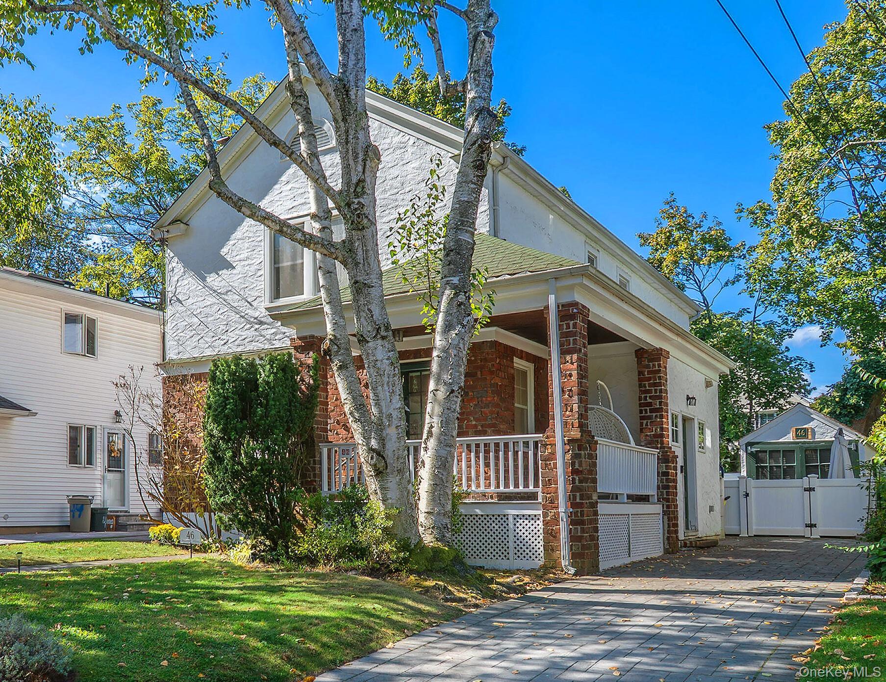 Newly renovated Front Porch Colonial with Brand New Kitchen and Baths. This move-in-ready home with blend of charm and modern amenities has 3 Bedrooms, 3 full Baths and boasts an open concept floor plan. The Living room with fireplace flanked by stained glass windows flows into the Dining room open to the Gleaming Kitchen with large center island, stainless appliances and gas cooking. French door opens to the family room and dedicated home office. A full bath and mud room complete the first floor. The second level has a Luxurious primary suite with new Bath with double sinks, ample closets and soaring ceilings plus 2 additional bedrooms and new bath. Finished basement with playroom and laundry. 1, 932 square feet not including the finished basement. Hardwood floors throughout, CAC, Security system and much more. Tucked away on a quiet street close to LIRR, Town and Parks