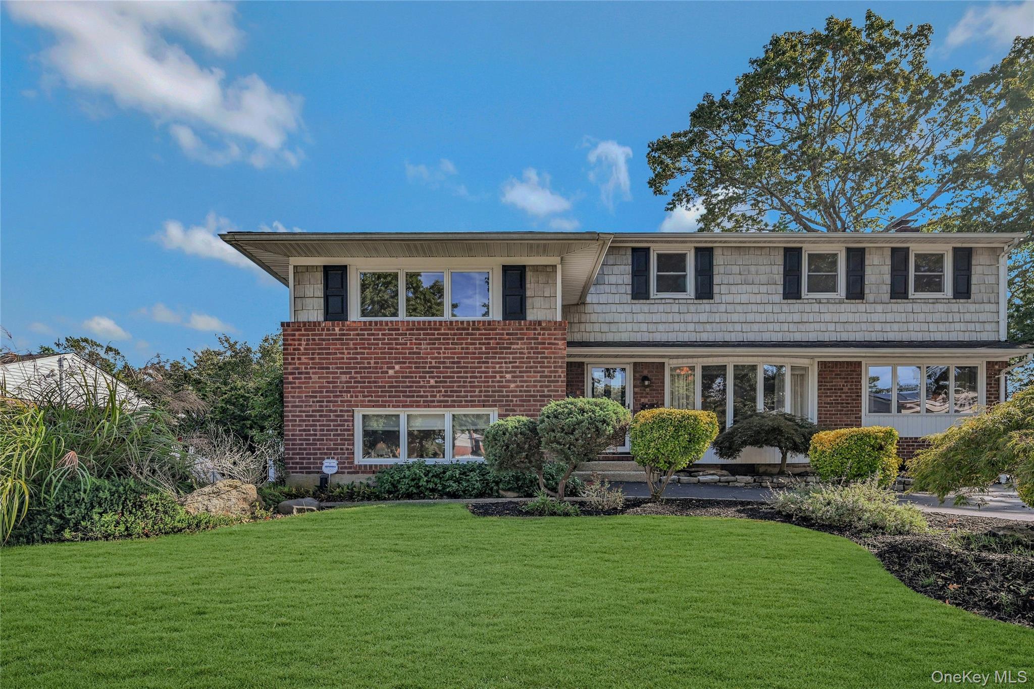 Fantastic 5 to 6-bedroom, 3 full-bath split-level home featuring oak floors and plenty of natural light. The eat-in kitchen flows into a family room with a cozy fireplace, and throughout the house, you&rsquo;ll find custom moldings that add a touch of elegance. Enjoy central air conditioning, ample storage, and sliding doors that lead to a lovely backyard complete with a patio and mature landscaping, all fully fenced for privacy. The completely legal third level includes a kitchen, bathroom, living room, bedroom, loft bedroom/office, with an expansive deck and private entrance. Potential rental income with proper accessory apartment permit. Finished basement, gas heat, separate hw heater, CAC. True taxes are $15.726.34. Commack School District