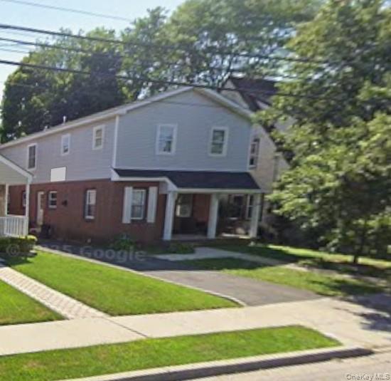 Charming brick and wood house in the heart of Hempstead! This 7-bedroom, 2-bath home offers classic appeal and endless potential. Features include a living room and kitchen. The property also includes a private driveway. Conveniently located near Hempstead Turnpike, Hofstra University, shopping, parks, and public transit, this home combines character and opportunity. Perfect for large households.