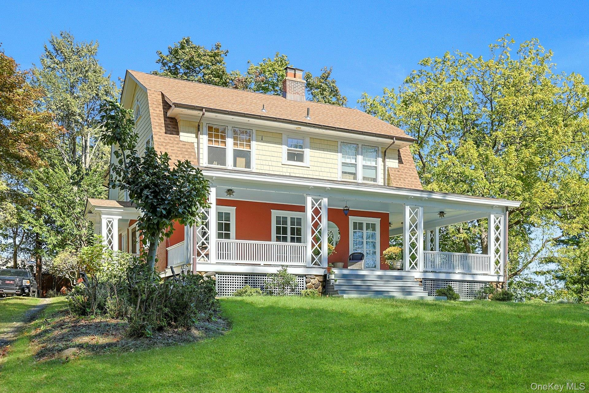 In Upper Nyack, tucked away on 1.26 private acres of meadow and mature trees, stands a fairytale home built in 1929. With 5 bedrooms, 2.5 baths, and approximately 3, 268 square feet of living space, including a 800 square-foot finished attic, this enchanting residence has been lovingly maintained by its current owner for many years.The first floor welcomes you with a generous entryway, leading into a double living room with a wood-burning fireplace and French doors that open to a 16-foot-wide wraparound covered porch. Perfect for spring-to-fall dining and entertaining, the porch has hosted countless memorable gatherings and is a perfect place for your summer dinners or your morning coffees. A gracious formal dining room, also with French doors to the porch, sits between the large country kitchen and butlerâ€™s pantry and the oversized living room with a natural flow ideal for everyday living and celebrations alike. A lovely powder room completes this level.Upstairs, the primary suite features its own private bath, while four additional bedrooms offer flexible space for family, guests, a home office, and fitness room. An additional beautifully renovated full bathroom serves this floor.The finished third level is an open-concept attic, perfect as a family room, studio, office, or additional sleeping area.The home also features a bright, clean, and bone-dry full basement. Here youâ€™ll find the washer and dryer, a 400 bottle wine cellar, an additional refrigerator and freezer, the homeâ€™s mechanicals, a workroom, and even a sauna with a shower beside it. The property is equipped with central A/C for year-round comfort.Outdoors, the 1.26 acre garden is just as special as the home itself. Expansive lawns stretch across the backyard, bordered by colorful perennial gardens and a vegetable patch. A brand-new gazebo and sitting area off the kitchen provide a peaceful spot for morning coffee or evening cocktails. The circular driveway offers convenience and ample parking.With its private yet convenient location and sere and peaceful ambiance, this is a rare and special home, that is not to be missed.