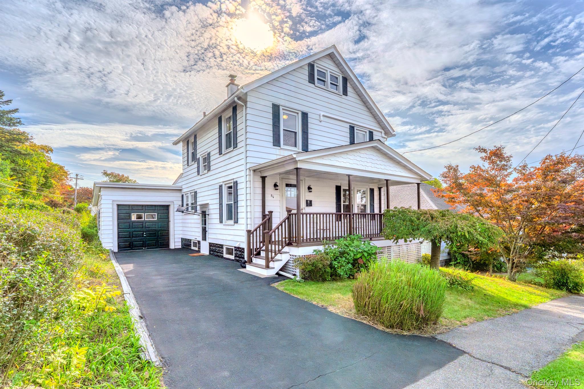 Located on a peaceful city street is this renovated classic two story home still filled with original character and charm! Step in from the spacious, inviting front porch to a large foyer where gleaming original hardwood floors flow throughout the main level! The open floor plan has large living and dining rooms and the kitchen has all brand new cabinets, quartz countertops, and matching Samsung stainless steel appliances. Conveniently located off of the kitchen is a newly added large half bath----Head up the wooden staircase to find more original hardwood floors throughout the three bedrooms. The full bath has also been updated. From one bdrm is access to a full walk up attic with electric and lots of natural light and fresh air coming through the windows. It&rsquo;s perfect for storage----The laundry is located in the basement which has lots of room for additional living and storage space. There is convenient access to the basement and kitchen from the driveway. Zoning allows for conversion to multiple dwellings with city approval----Enjoy your outdoor time on the newly built deck which is accessible from the kitchen. Great for those barbecues and gatherings Large, spacious backyard is partially fenced with plenty of room for a pool. The one car attached garage has electric. New heating/cooling units in all bedrooms and main living area. Centrally located to Uptown, Downtown, and Ulster Ave. shopping and eateries.