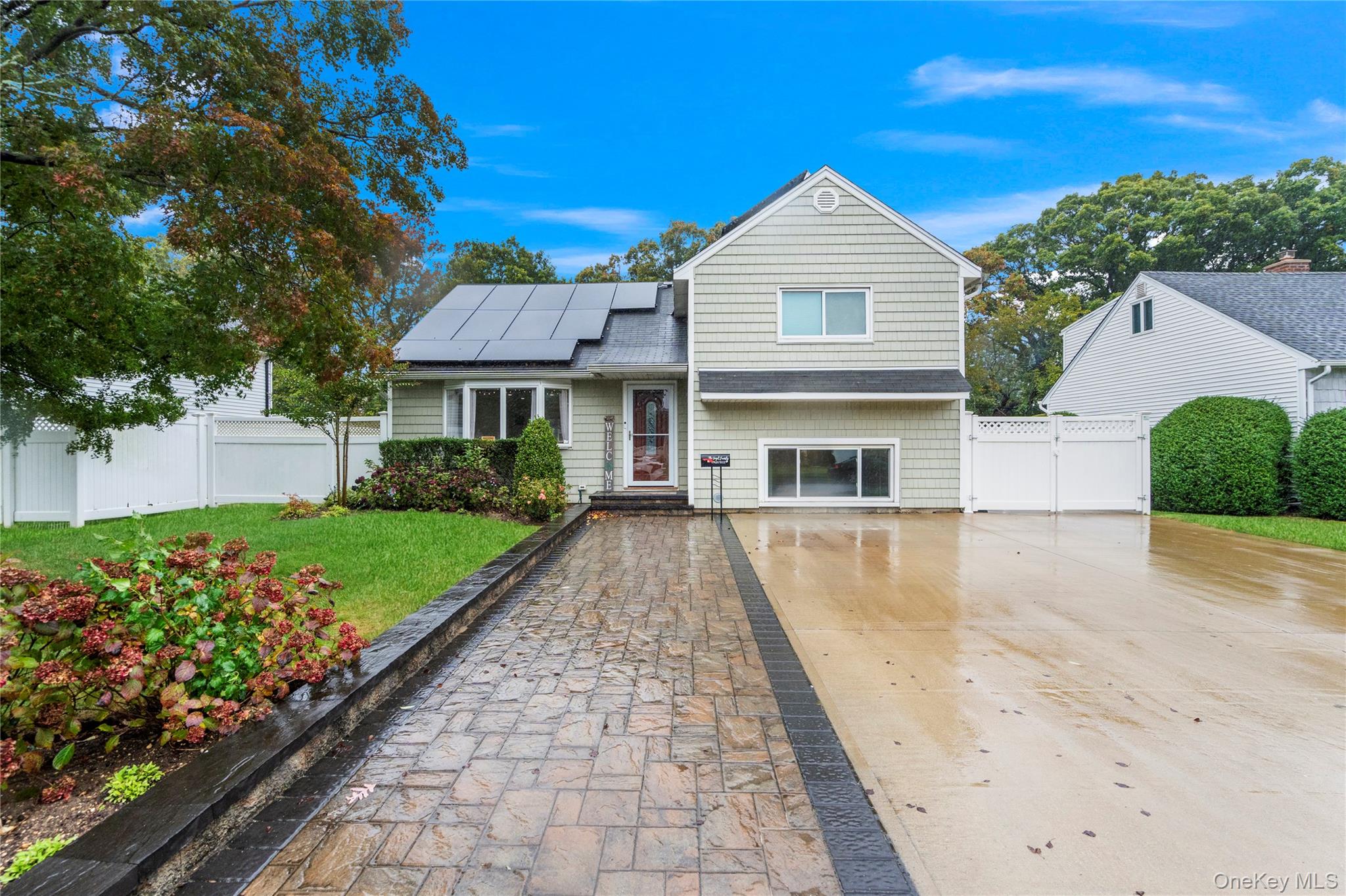 Pride of Homeownership!This beautifully updated Split-Level home has been fully renovated and meticulously maintained by its current owners.From the moment you arrive, youâ€™ll notice the impressive double driveway, Cambridge paver walkway and stoop, and tastefully colored vinyl siding (2013). Step inside to a bright, open-concept living space (2022) featuring newer insulation, sheetrock, and updated electric. The home showcases gorgeous chestnut hardwood floors, custom crown molding, and hi-hats throughout.The kitchen is a showstopperâ€”white shaker cabinets, quartz countertops, stainless steel appliances (2022), and a large center island with seating. A banquet-sized dining room with sliders featuring built-in shades opens to the backyard. The living room is warm and inviting with a quaint bay window perfect for decorating or peaceful views.A few steps down leads to a versatile den or playroom with space for a home office (2025). Upstairs, youâ€™ll find two spacious bedrooms with dual closets and a shared full bath. The third-floor primary suite offers a king-size bedroom, two closets, and a private en-suite bathroom.Additional features include gas heating (2006), central air (2024), and in-ground sprinklers. The backyard is an entertainerâ€™s dream, with a massive patio, covered area, and built-in fire pitâ€”all while leaving plenty of lawn space to play and relax.Solar panels (installed 2024) are financed to own for 25 years and cover 100% of the homeâ€™s power usage. A Must-See Home!