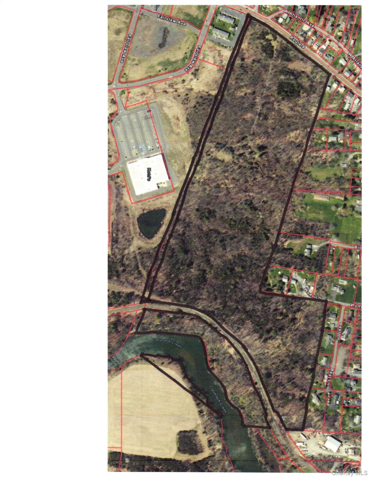 Prime Development or Investment Opportunity on Route 9 â€“ Greenport/Stockport LineDiscover approximately 61 acres of exceptional development potential along Route 9, perfectly positioned on the Greenportâ€“Stockport town line.Property Highlights:Zoning: Hamlet and Residential with a partial Senior Citizen Overlay; rear portion zoned Rural Residential.Utilities: Access to municipal water, sewer, electricity, and natural gas.Natural & Recreational Amenities: Over 1, 000 feet of Claverack Creek frontage and direct access to the Albany-Hudson Electric Trail.Topography: Mostly wooded with a mix of flat to gently sloped terrain.Traffic Count: NYS DOT 2024 Average Daily Traffic â€” 11, 540 vehicles.Surrounding Area:Situated in a vibrant corridor featuring both residential and commercial development, the parcel is adjacent to Widewaters Commons, home to major anchor retailers and smaller shops.Location Advantage:Just 10 minutes from Downtown Hudson, with easy access to the Amtrak Station, restaurants, and boutique shopping.This property offers a unique blend of infrastructure, visibility, and natural beautyâ€”making it ideal for development.