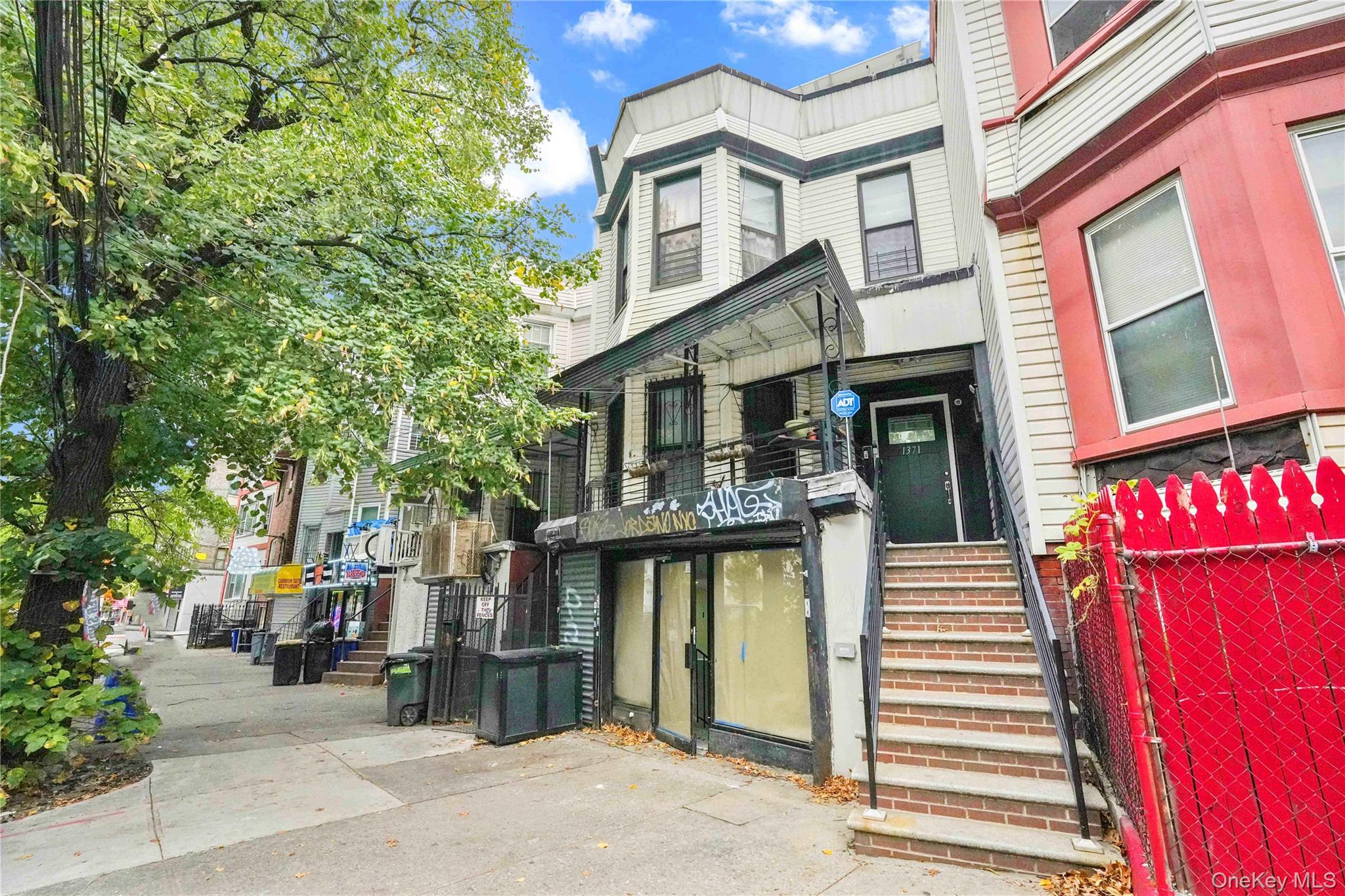 If you are looking for a fully renovated, turnkey investment property, then this is one you will want to see. Currently generating over $8, 300 per month, this mixed-use, three-unit home features a 3-bedroom apartment, over another 3-bedroom apartment, over a commercial space, which is leased as a nail salon. The home has been updated with solar panels and split system heating for maximum efficiency. Located close to Crotona park, and excellent public transportation.