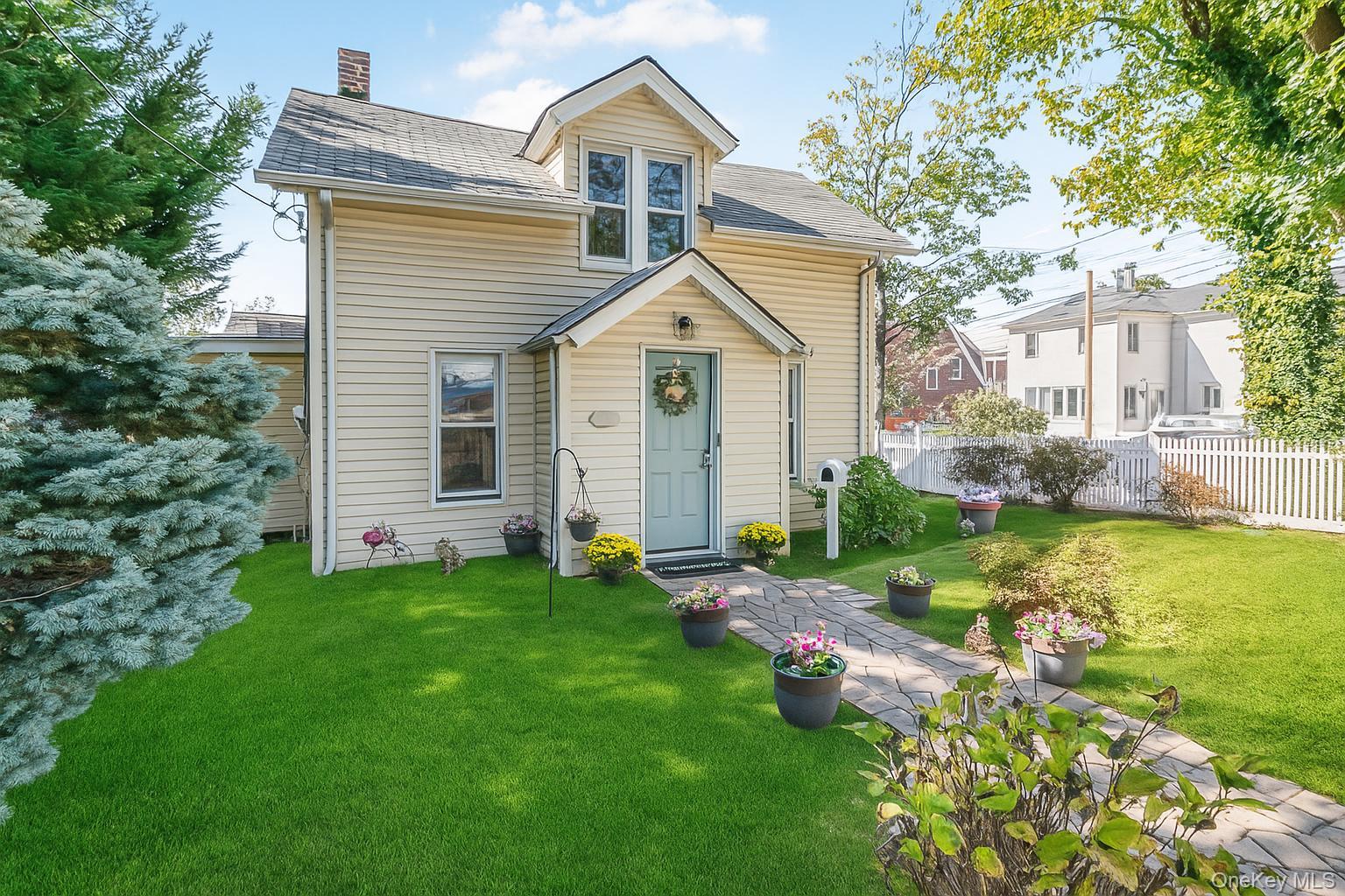 Rare City Island Find! Welcome to 393 City Island Avenue â€” a bright and inviting 2-bedroom, 2-bath home ideally located in the heart of City Island on a 100â€™ x 50â€™ corner lot. This charming property blends character, comfort, and convenience in one of New York Cityâ€™s most unique waterfront communities. Inside, youâ€™ll find two spacious bedrooms and two full baths, including one with a private en suite. The sun-filled family room opens directly to a private backyard â€” perfect for relaxing, entertaining, or family gatherings. Enjoy added privacy and outdoor space with the fully fenced yard, plus the convenience of a private driveway for off-street parking. Just steps from City Islandâ€™s popular restaurants, shops, marinas, and waterfront attractions, this home combines small-town charm with easy access to major highways and public transportation. Experience island living at its best â€” right here at 393 City Island Avenue.