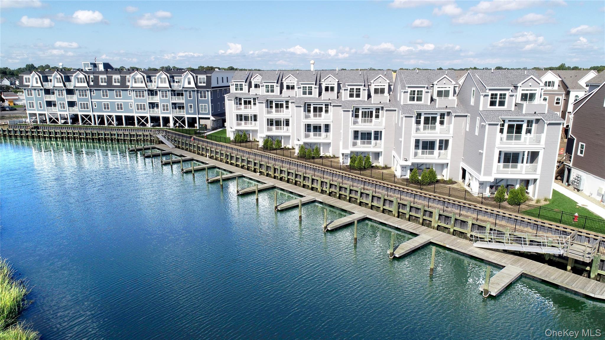 Welcome to 535 Marina Pointe Drive, a thoughtfully designed 2-bedroom, 2-bath condo suite offering 1, 241 square feet of stylish, open-concept living. This bright and airy home features a spacious primary bedroom with an oversized closet and a private en-suite bath, complete with a dual-sink vanity and shower.The chef-inspired kitchenâ€”equipped with a center island, modern appliances, and ample storageâ€”flows seamlessly into the living room and dining area, perfect for both entertaining and relaxing. Large windows invite natural light into every corner, enhancing the homeâ€™s warmth and openness.The second bedroom, located on the opposite end for added privacy, includes its own oversized closet and is adjacent to the full secondary bathroom. A private balcony extends your living space outdoors, offering water viewsâ€”perfect for enjoying your morning coffee or unwinding in the evening.Located within a beautifully maintained community, this condo blends low-maintenance living with elegant design. Sale may be subject to term & conditions of an offering plan. This property is subject to an existing tax exemption as outlined in the offering plan. Purchaser should independently verify tax information.