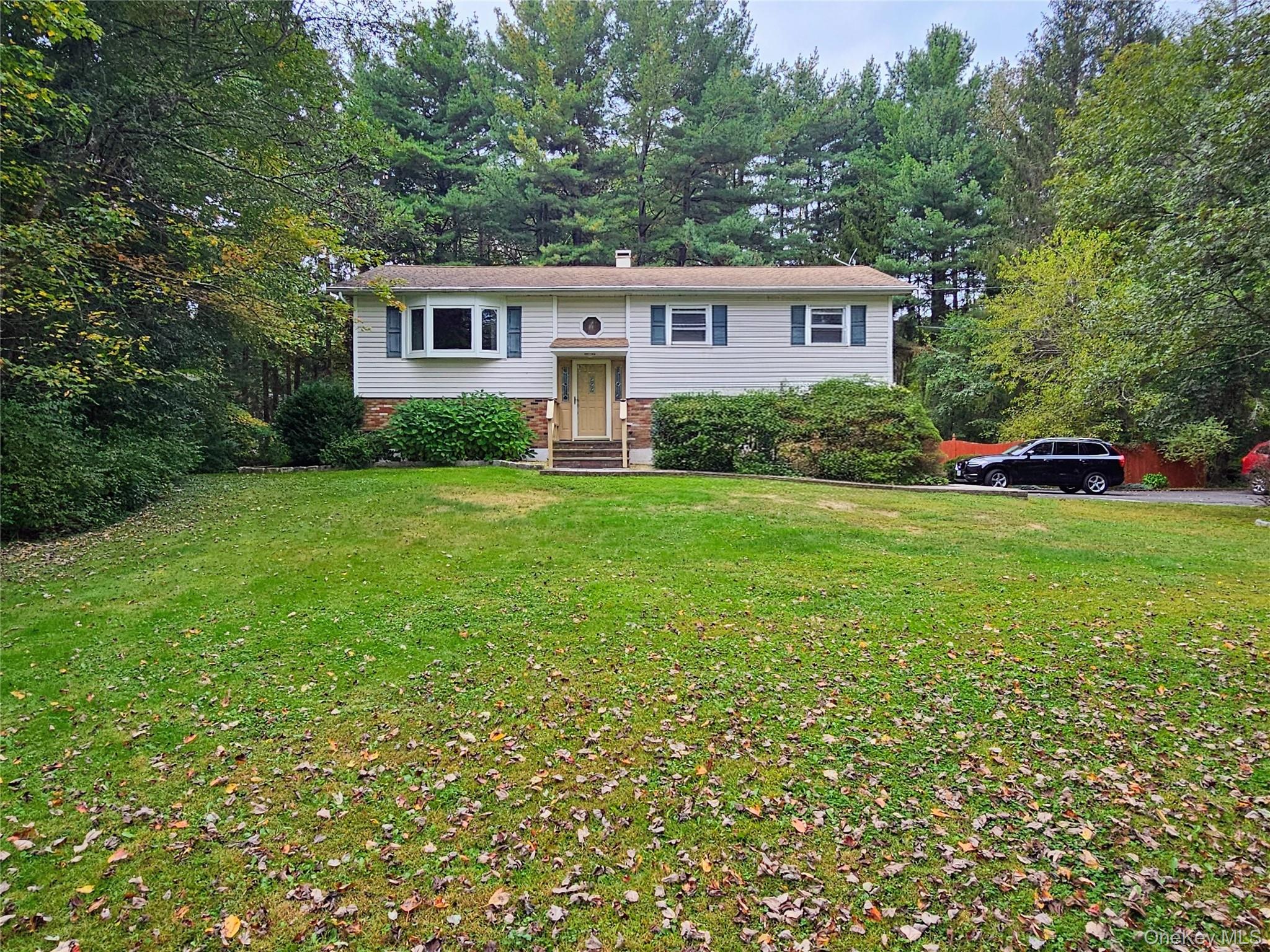New to the market! Well maintained Bi-Level with legal 1 bedroom apartment. Perfect for income producing or in-law living or use it for den and family room. Total 4 bedroom, 2 baths. Sets on 1 semi-private level acre, centrally located to I-84, route 9, trains, town, shopping schools and much more. Atrium doors open to Large 3 season room, (could be 4 season very easy.) A one owner home, new water heater, roof 8 years old, furnace serviced every year and will be service is scheduled now. Large 2 car garage and ample drive way parking. Water softener owned. House sets back from the road allows for privacy.