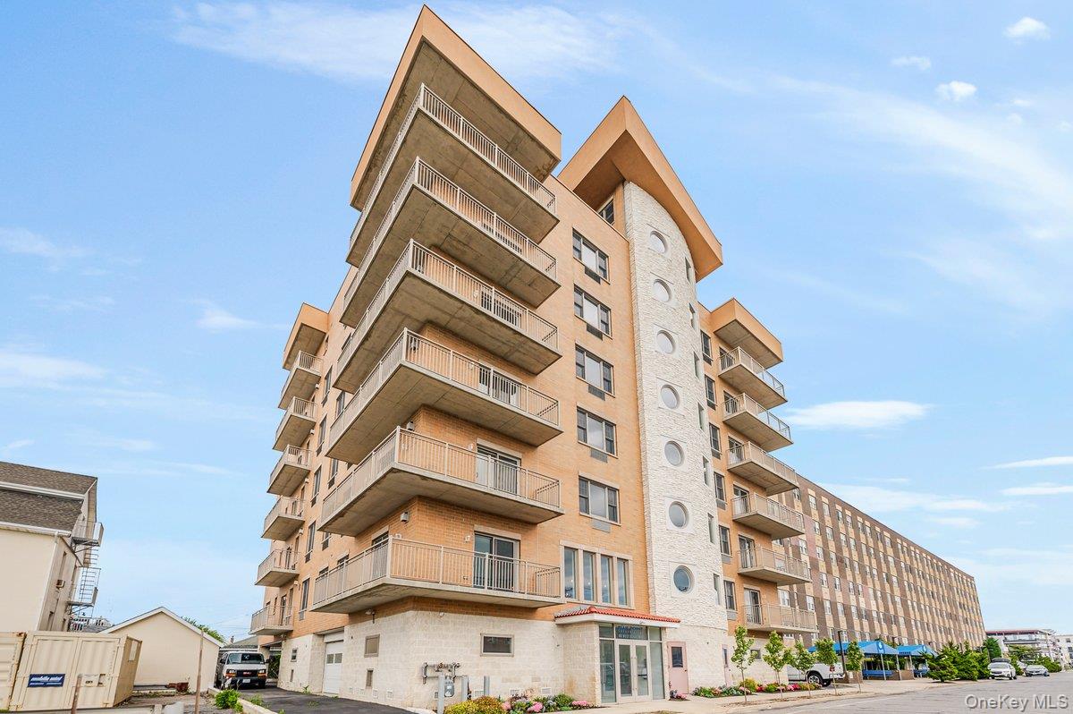 Long Beach Blue Point Condominium, Brand New Oceanview 3 Bedroom, Open Concept Living Room/Dining Area With Fireplace and Private Wrap Around Terrace, Kitchen, Granite Countertops, Stainless Steel Appliances, Primary Bedroom With Private Bathroom Including Jacuzzi and Walk-In Shower, Bedroom, Bedroom, Full Bath, Washer/Dryer, Heating & Cooling Units, Wood, Floors, Tiled Bathrooms, Recessed Lighting, Indoor Parking Spot, Concierge, Gym,  Pet Friendly, Close To Beach, Boardwalk, Shopping, Restaurants & LIRR