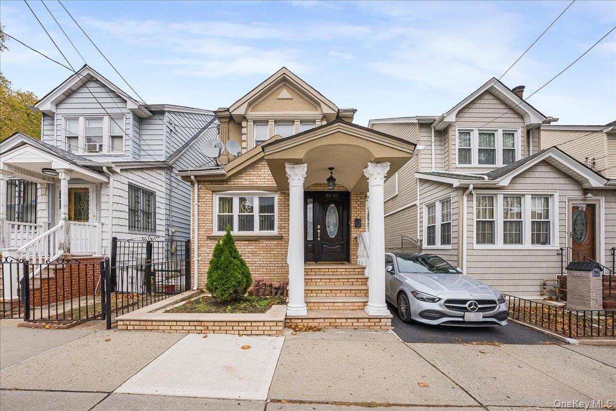 This beautifully updated and impeccbly maintained single-family Colonial combines timeless charm with modern upgrades in a prime Richmond Hill North location. Situated on a 2, 407 sq. ft. lot, the home features a paved private driveway that accommodates up to three cars, plus a detached garage.On the first floor, a welcoming living room with bay window flows into the formal dining room, creating a bright and inviting entertaining space. The brand-new kitchen is outfitted with wood cabinetry, stainless-steel appliances, and generous counter space. Also on this level, a private bedroom with a brand-new ensuite bathroom offers flexibility for guests or multigenerational living.The second floor hosts the expansive primary suite, created by combining two original bedrooms into one sprawling retreat, alongside additional bedrooms. The renovated bathroom on this level features a large stand-up shower with an elegant glass partition.The third floor boasts a very large bedroom with gleaming hardwood floors and abundant storage space, perfect as a secondary primary, a studio, or a multipurpose living area.Downstairs, the finished basement expands functionality with a dedicated laundry room that also includes a half bath for extra convenience.Outdoors, enjoy a large paved, fully fenced backyard ideal for gatherings, gardening, or peaceful relaxation.Located just steps from Forest Park, residents can take advantage of acres of green space, trails, and recreation, while being close to Jamaica Avenue shopping, major retailers, and having quick access to the Belt Parkway, Jackie Robinson Parkway, and Van Wyck Expressway.