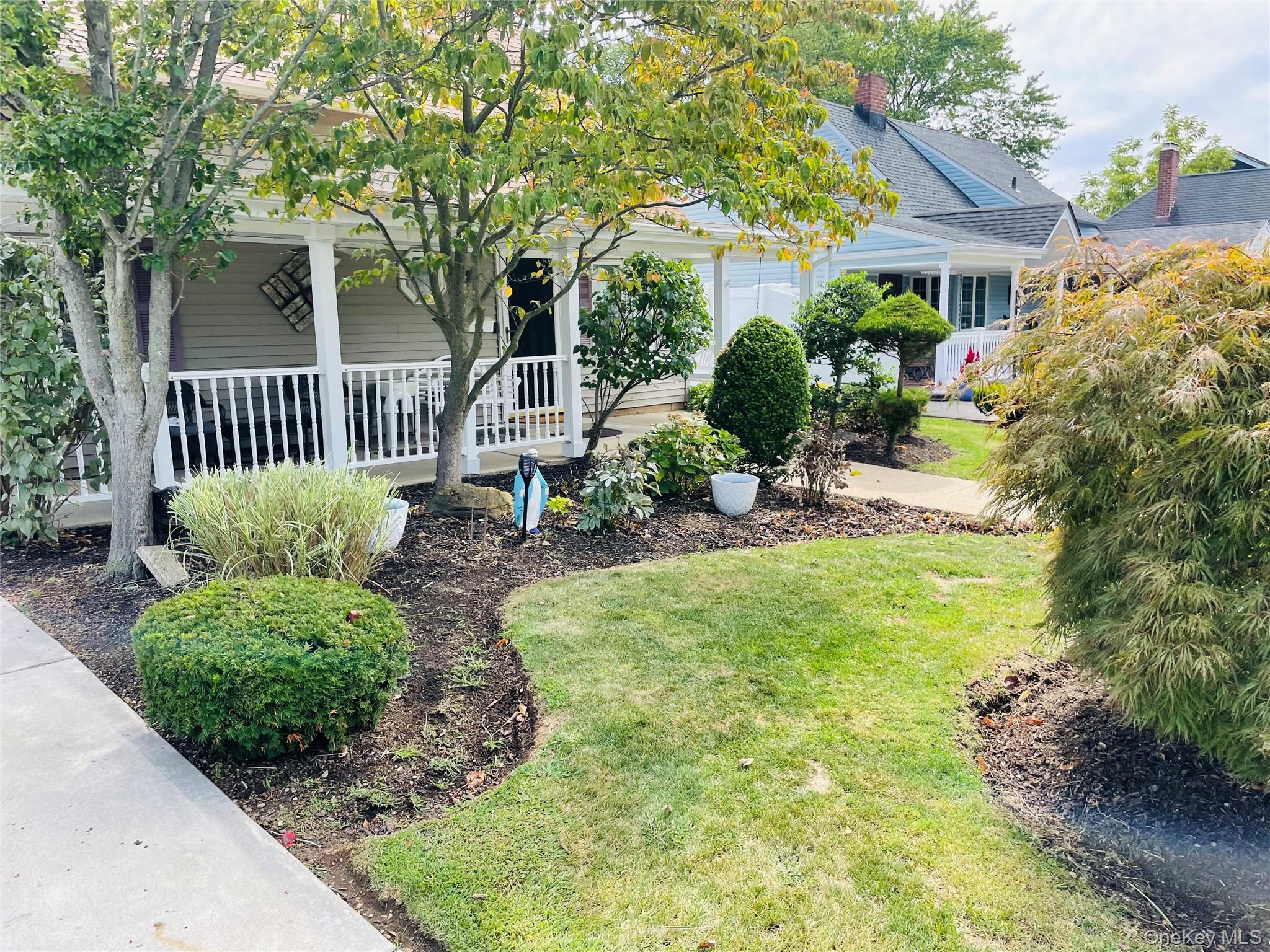 Welcome to this updated expanded ranch style home in the desirable W section of Wantagh. This home offers 3 bedrooms and one and a half baths, with lots of upgrades. Beautiful Bamboo flooring in the extended living room and in the two upstairs bedrooms. Enjoy the large kitchen with a wonderful hightop breakfast bar. Kitchen also has a large microwave above the stove that is also a convection oven. Brand new dishwasher and also a garbage disposal! Large formal dining room with a beautiful cathedral ceiling. The home is also equipped with 4 ductless AC/Heating units and 1 large ductless AC unit in the living room. Enjoy your morning coffee on your large porch with a porch swing!