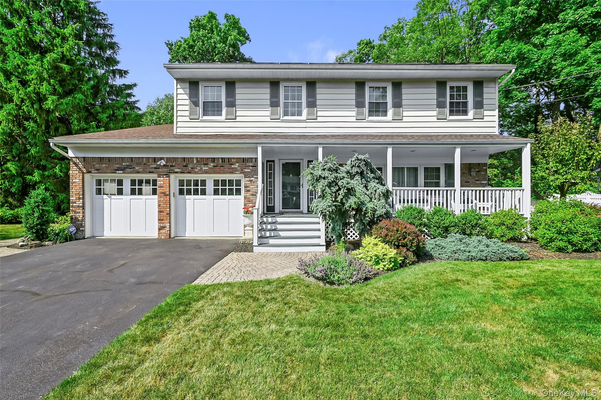 Home sweet home! Welcome to this meticulously maintained and thoughtfully renovated 4 bedroom, 2.5 bathroom colonial located on a nice, quiet street in the Village of Goshen. For sale for the first time in over 30 years, this is a wonderful place to call home. Well cared for, renovated, and updated throughout the years, this residence is move-in ready with a newly renovated kitchen, recently renovated bathrooms, and freshly repainted. The owned Solar Panels on the roof produce the current owners complete electrical needs including the whole-house central air conditioning. The owners currently pay about $20/month connection fee to Orange and Rockland. A natural gas-powered Generac generator is rarely needed but gives peace of mind to never be without electricity. Gleaming hardwood floors are found throughout the main floor. New windows are throughout the home and basement. New six-panel doors throughout the house. The newly renovated kitchen features granite countertops, Blanco granite sink, shaker cabinets, a movable kitchen island with cabinets and drawers, recessed lighting, a natural gas stove/oven, and a kitchen desk area. Reverse osmosis water faucet at kitchen sink. The formal dining room features hardwood floors, crown molding, French doors to living room, pocket door to kitchen, an Andersen sliding door exit to the patio and back yard. The spacious living room is great for hosting guests - featuring a front picture window, hardwood floors, crown molding, and a large coat closet. The family room features a large picture window to the back yard, a Mendota gas fireplace, and an exit to the rear patio. Have a drink from the bar room located off the family room. Laundry area with well-organized shelving. A recently renovated half bathroom is conveniently located on the main floor. On to the second floor - the large primary bedroom features two spacious walk-in closets, an en-suite bathroom, hardwood floors and crown molding. The primary en-suite bathroom has a dual vanity sink with granite countertops, crown molding, marble-like porcelain tile flooring, and a multi-jet Jacuzzi and shower. Bedroom 2 with hardwood flooring is currently used as an office with two nice sized closets. Bedrooms 3 and 4 are nice sized bedrooms with windows to the backyard, large closets, and carpeting. The full second floor hallway bathroom features Marble-like porcelain tile flooring, dual sinks and crown moldings. The full, unfinished basement provides for plenty of storage with tall ceilings and contains the main utilities including the Natural gas fired furnace with hot water tank and the water softening system. The storage area below the family room provides for more additional storage.The yard is professionally landscaped and is easy to maintain. The back yard is kept private with its new enclosed fencing, having two separate gates on either side of the residence. The paver patio is excellent for relaxation and enjoyment with entrances from the dining room, kitchen, and family room. A spacious shed for your additional storage needs. Leaf filter gutter guards on all gutters.The 2 Car garage features an Epoxy resin floor, with a side door exit to the paver walkway leading to the back yard. ChargePoint Level 2 Fast Electric Car Charger with 220V power supply in the garage. Garbage (2x per week) and recycling (weekly) included with the taxes. Natural gas service and municipal water and sewer.This is an excellent move-in ready residence on the quiet Camelot Drive in the Village of Goshen,  situated on a 0.45 acre corner lot to a cul-de-sac. Close to the highways State Route 17 (Future Interstate 86), Interstate 84, Village of Goshen commuter bus stop to New York City, Campbell Hall Train Station, LegoLand. Located in the heart of Orange County in the Hudson Valley, New York.