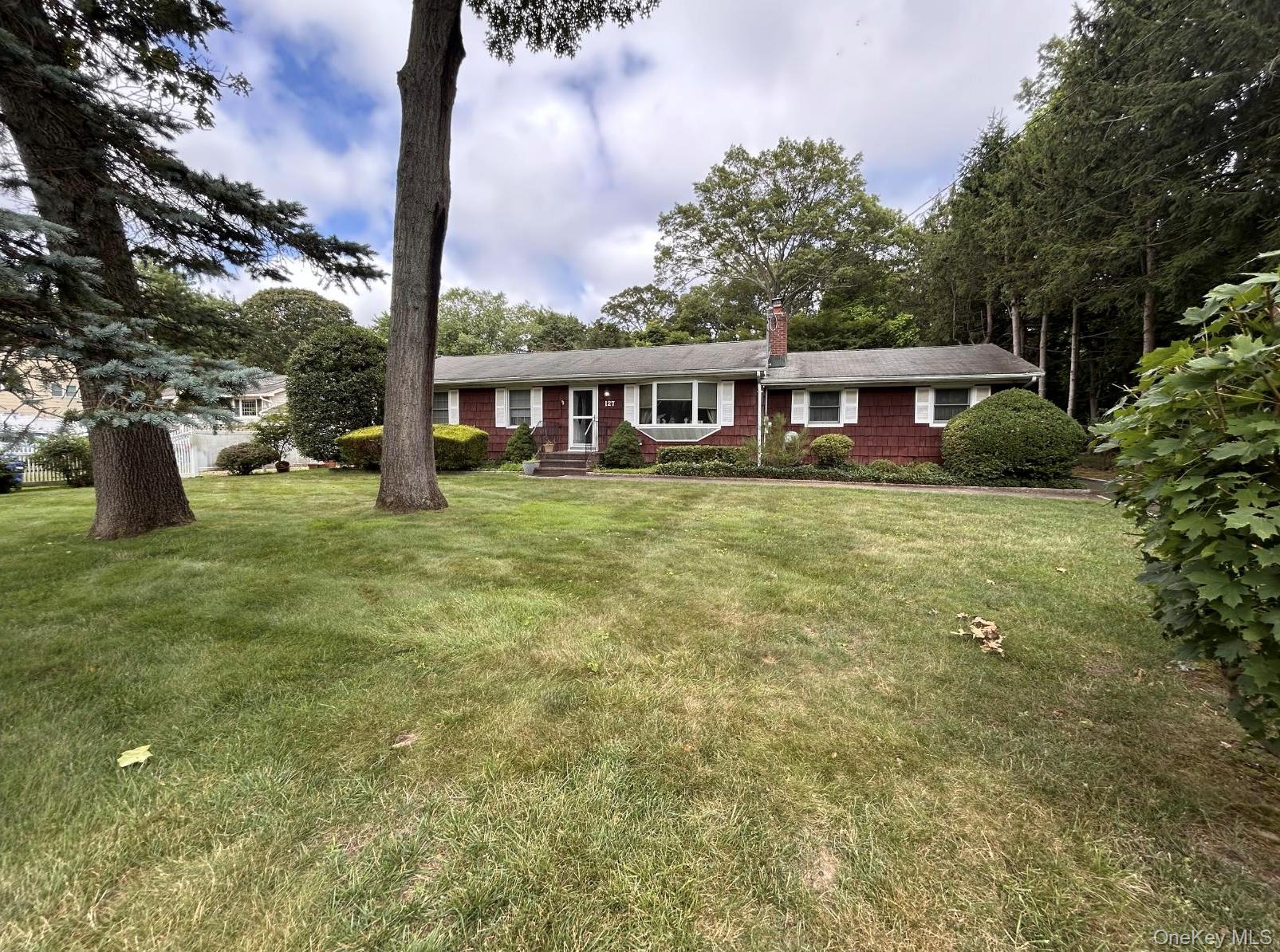 Welcome to this beautifully expanded ranch in the highly sought-after Saint James community! This spacious 4-bedroom, 2.5-bath home sits on a generous &#189;-acre lot and offers over 2, 300 sq. ft. of living space, plus a partially finished 900 sq. ft. basement with an additional office and half bath. Highlights include two dedicated office spacesâ€”one on the main level and one in the basementâ€”perfect for todayâ€™s work-from-home lifestyle. Enjoy a large craftsman-style wooden deck ideal for entertaining, a large patio and a detached 2-car garage (approx. 900 sq. ft.) with loft and separate back-room workshop, complete with a 50-amp subpanel. The property also features a backyard storage shed and a two-zone sprinkler system for the front and rear yard. The first-floor primary suite, added in 2005, offers a 500 sq. ft. master bedroom with walk-in closet and ensuite bath. The roof is approximately 10 years old. A home with great bones, thoughtful updates, and endless potentialâ€”located close to shopping, transportation, and top-rated schools in one of Long Islandâ€™s most desirable areas!