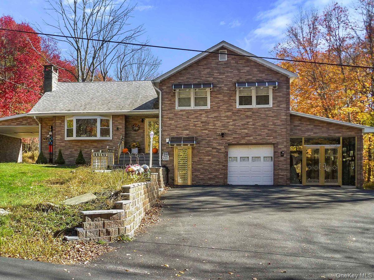 Modern Split-Level Home Located in the Hamlet of White Lake NY3 BR, 2.5 BA  2.12 Acres  Pool & Workshop  EV ReadyWelcome to this turn-key split-level residence,  situated on a scenic road in the Catskills Region. Near White Lake, Bethel Woods Center for the Arts, Kartrite Resort and indoor water park, Legoland and Resort Worlds Catskills, this home provides the perfect blend of tranquility and convenience.Meticulously maintained and set on a private 2.12-acre lot, this property offers an unparalleled combination of space, modern amenities, and private outdoor living.The interior features a flexible layout including 3 spacious bedrooms, 2 full bathrooms, Kitchen with backyard deck access, an additional versatile roomâ€”perfect as a home office, den, or guest suite with an adjacent bathroom. The main living area is anchored by a cozy wood-burning fireplace, ideal for relaxing on cooler evenings.This property is designed for comfort, convenience, and year-round enjoyment, Step out to your private backyard featuring an in-ground swimming pool, the ultimate setting for summer entertaining and relaxation. A substantial shed/machine shop offers generous space for hobbies, equipment storage, or a dedicated workshop.Enhanced with a reliable automatic Generac generator for total peace of mind and a dedicated EV-Charging Station. Features stainless steel storm doors and railings for durability and curb appeal. Includes both an attached garage and a convenient carport,  full basement, offering excellent storage or potential for future finished space.This exceptional home is move-in ready and waiting for its new owner.