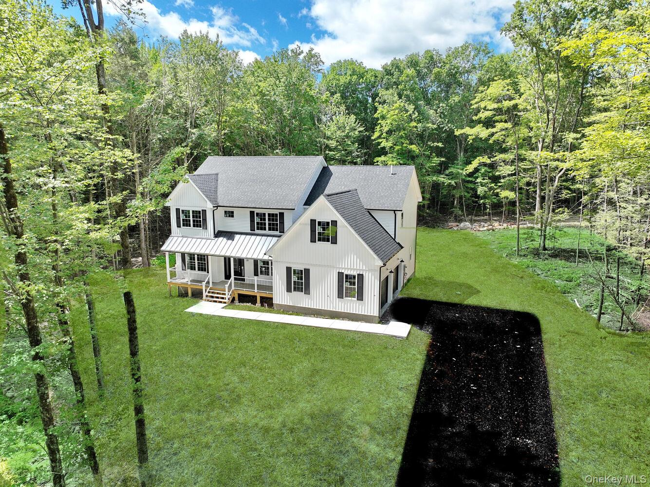 BRAND-NEW MODERN FARMHOUSE, READY JUST IN TIME FOR THE HOLIDAYS!Discover bold, modern living on one of the last premium lots in this exclusive 9-lot cul-de-sac community. Perfectly set on 5.199 private acres, this striking new construction farmhouse blends luxury, privacy, and space like nothing else on the market. Offering nearly 5, 000 sq. ft. in total, including 3, 000+ sq. ft. of refined living area, a 1, 250+ sq. ft. walkout-ready unfinished basement, and an oversized 520+ sq. ft. garage, this home delivers exceptional scale and design.Step onto the inviting Trex front porch, elegantly covered by a freestanding roof with soffit-mounted recessed lighting and a charming railing, the perfect place to unwind and enjoy the crisp fall air. Inside, a welcoming foyer opens to a bright, open-concept main level, designed for effortless living and entertaining.The chef-inspired kitchen is a true centerpiece, boasting sleek Quartz countertops, stainless steel appliances, a designer farmhouse apron-front sink, vented range hood, center island, tiled backsplash, and ambient lighting that brings it all together. Flowing seamlessly into the cozy dinette and spacious great room with a dramatic custom gas fireplace, this space is ideal for gatherings or relaxing nights at home. Step outside to the expansive 16&rsquo; &#215; 10&rsquo; deck, perfect for entertaining guests or enjoying peaceful views.The main level also offers a formal dining room for special occasions, a versatile office/den, a convenient powder room, and thoughtful details like the Lincoln Park interior doors that add a modern Craftsman touch with lasting durability.Upstairs, retreat to the luxurious primary suite, complete with vaulted ceilings, a generous walk-in closet, and a spa-inspired ensuite bath featuring dual vanities, a freestanding soaking tub, and a fully tiled shower. Three additional well-appointed bedrooms, two with walk-in closets, share a stylish full bath with dual vanities. A second-floor laundry room and a spacious finished bonus room complete the upper level, offering both comfort and flexibility.Additional highlights include high-end wood flooring throughout, charming window shutters accenting the front elevation, an inviting mudroom, extra garage storage, an underground propane tank providing clean, efficient energy, and a walkout basement with three oversized above-grade windows and plumbing for a future bath, ready for your finishing touch.Celebrate the holidays and every season ahead in this extraordinary home that balances modern design with timeless warmth. Schedule your private tour today and make this dream home yours!
