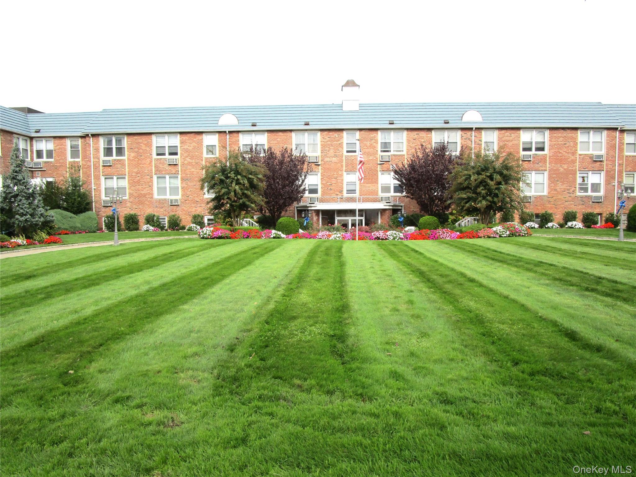 Welcome to the Noble House. A Meticulously maintained Co-op building nestled in Lynbrook. It boasts a palatial lawn and beautiful gardens. The Two bedroom-two bath includes two (2) terraces that overlook the beautiful landscaped view. Maintenance: $1281.65, includes gas heat, gas oven, taxes, water and sewer, plus care of the common area. Indoor Garage Space: $65 Monthly, A total of One Guaranteed Assigned spot per Apartment. Take the Elevator to the 1st Floor where this unit is located. The desirable floor plan is approximately 1100 sq. ft. Upon entering there&rsquo;s a nicely sized entrance foyer and coat closet, Living Room- Formal Dining Rm combo, Efficiency Kitchen with window above sink, Eating Area directly outside Kitchen, Two Bedrooms, Two FBTH&rsquo;s and generous closet space. The Primary Bedroom has a walk-in Closet and private Bathroom with a stall shower and window. One of the two terraces includes an electric outlet allowing an electric grill for cooking or charging your devices while relaxing outdoors, both terraces are covered. Amenities: Outdoor Private Inground Pool in a park like setting, the Lobby Level has a Storage Room, Laundry Room, Mailroom and Library, Community Room, Entrance/Exit to Indoor Garage, Entrance/Exit to Outdoor Pool and the Resident Super Apt.. Property is conveniently located to LIRR, Neighborhood shopping, Cinema, and Parkway. Sorry NO PETS ALLOWED!!! NO SMOKING ALLOWED!!! Out of pocket expenses Electric utility which is metered and your choice of Cable/Internet service Verizon Fios or Optimum.
