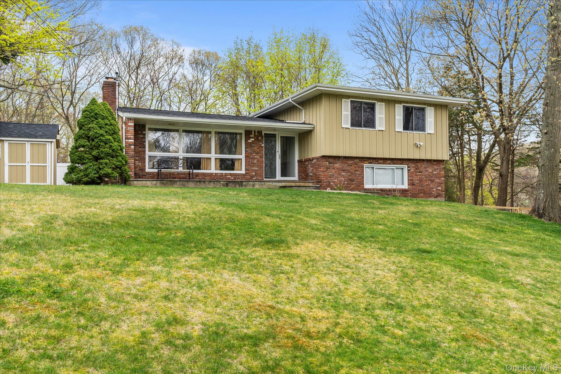 A Rare Opportunity in Miller Place, Levon Hills. Contemporary, Unique, Split Level 3 + bedroom Home. Privately situated On .69 acre, elevated parcel North of North Country Road. Close to Cedar Beach & Mt. Sinai Harbor. Blue Ribbon. Award Winning,  Miller Place Schools. Welcome home to a sun filled Entry Foyer, Formal Living Room with Wood Burning Fireplace, Formal Dining Room and Beautiful Updated Kitchen w/Granite, New Dishwasher, New Sliding Glass Door with Access to private yard, in ground pool and hot tub.. Second Floor Features Primary Bedroom with Updated Full Bath, 2 Additional Bedrooms and Full Bath. Lower Level, Fourth Bedroom Guest Suite w/Full Bath or Family Room Four Seasons Room Overlooking 20 X 40 Inground Pool. Additional Features Include, Hardwood Floors, Updated Heating System and Oil Tank, Hot Water Heater, 2 Zone CAC.